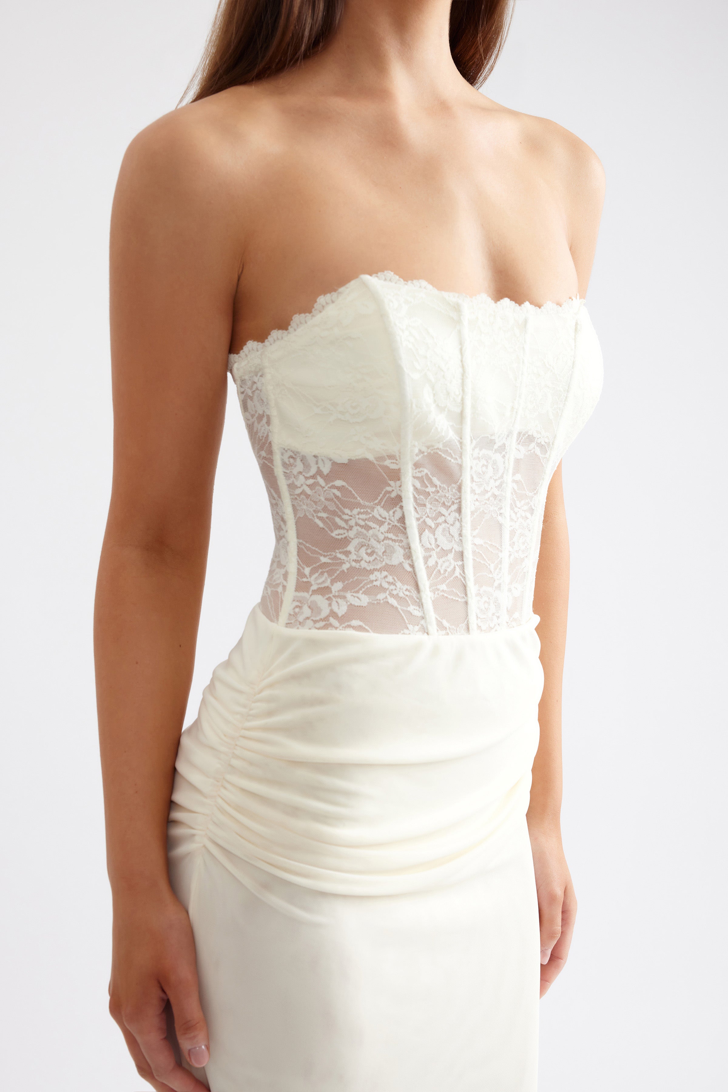 Alla Dress strapless gown with sheer lace corset bodice and ruched skirt detail in butter cream for formal occasions by Studio Lexi