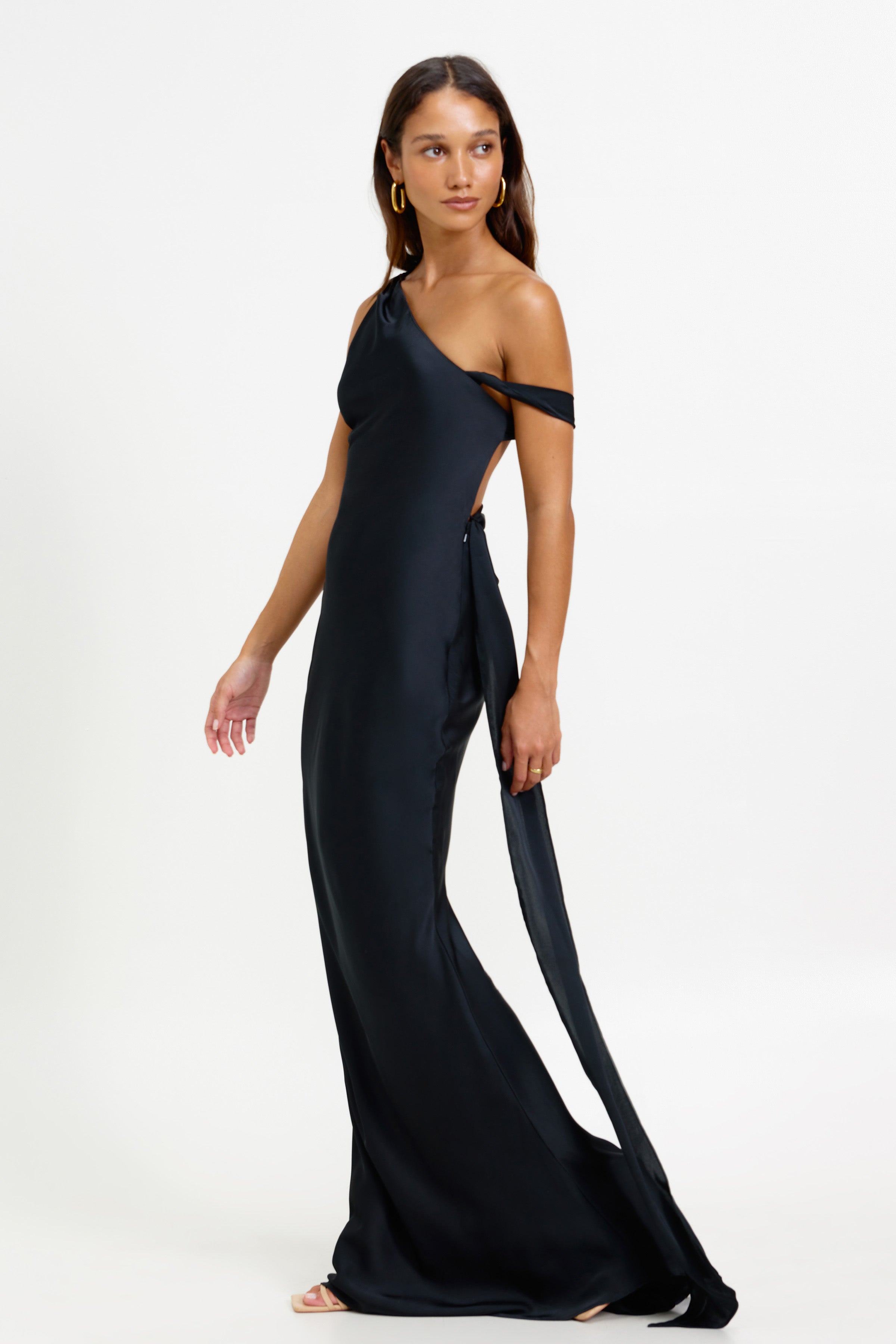 Ara Dress featuring an asymmetric one-shoulder silhouette with sleeve detail and small train in black satin for formal occasions