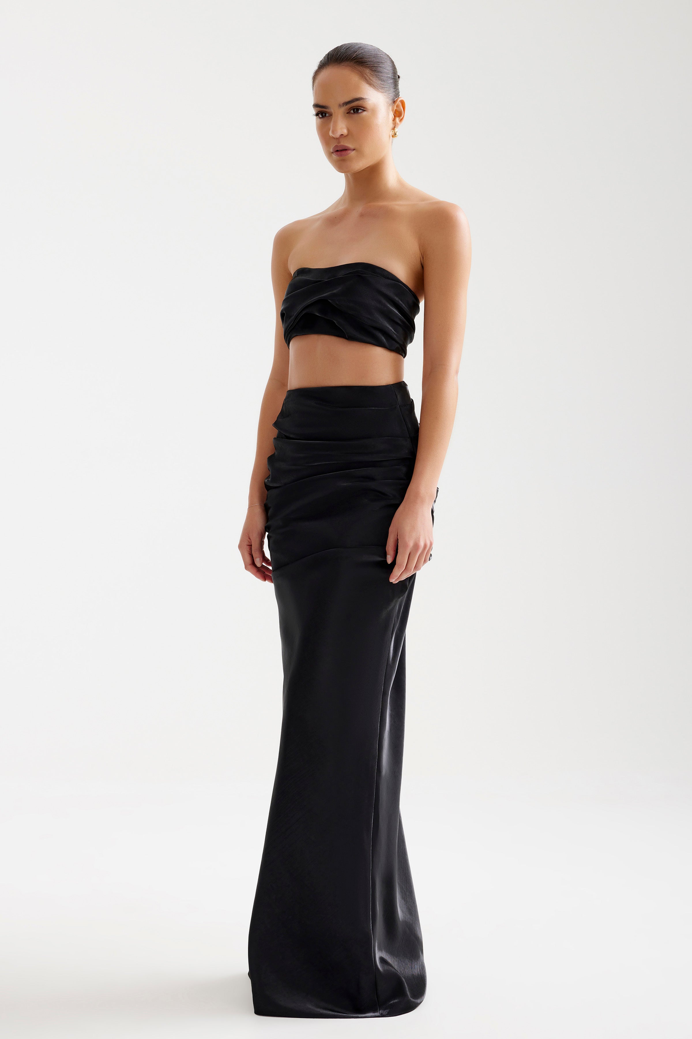 Ariana Set featuring a strapless bra-friendly top with ruched detailing and a sleek high-waisted skirt in black by Studio Lexi