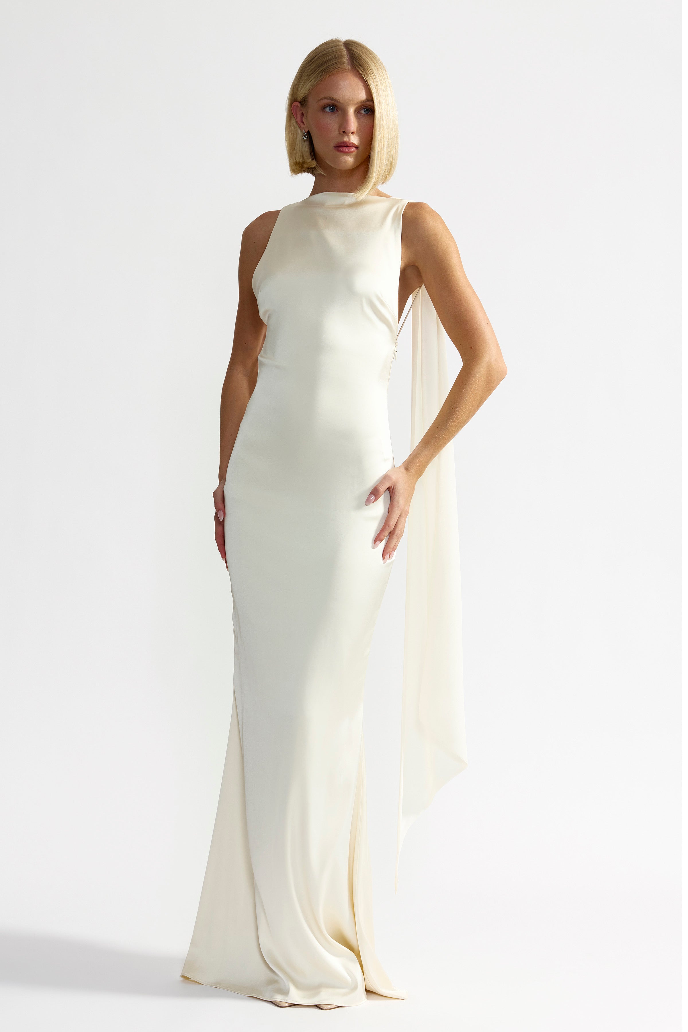 Audrey Dress backless design with high neckline and adjustable tie straps in elegant butter cream by Studio Lexi