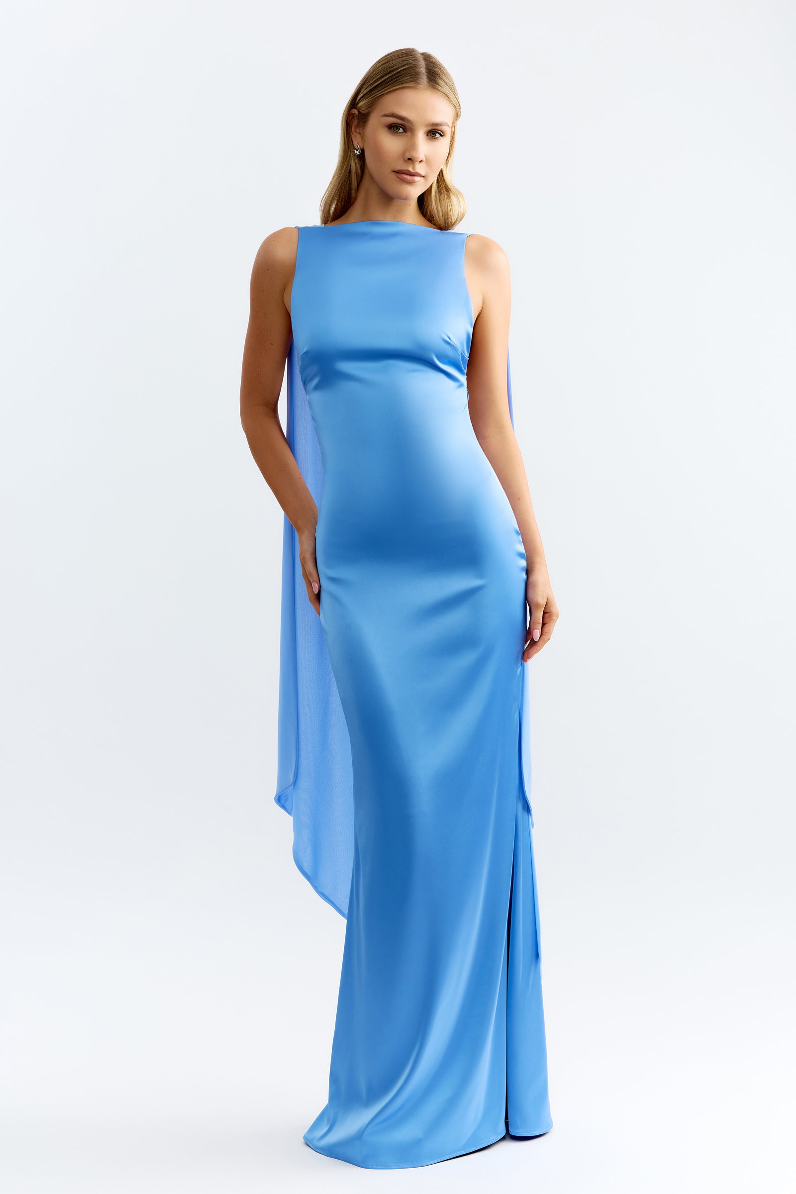 Audrey Dress featuring a sleek silhouette with a cape detail and side slit in ocean blue for formal occasions by Studio Lexi