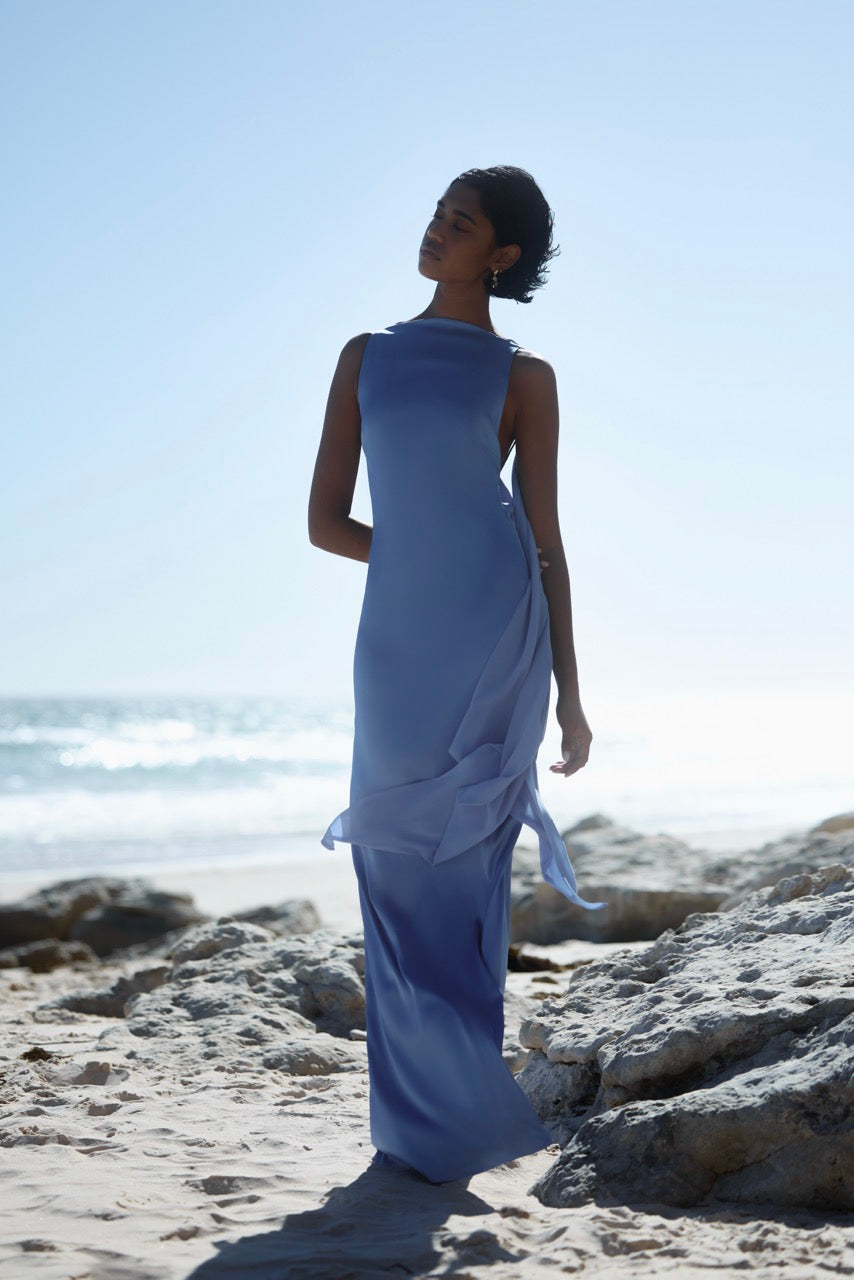 Audrey Dress featuring a sleek silhouette with backless design and flowing details in ocean blue for formal occasions
