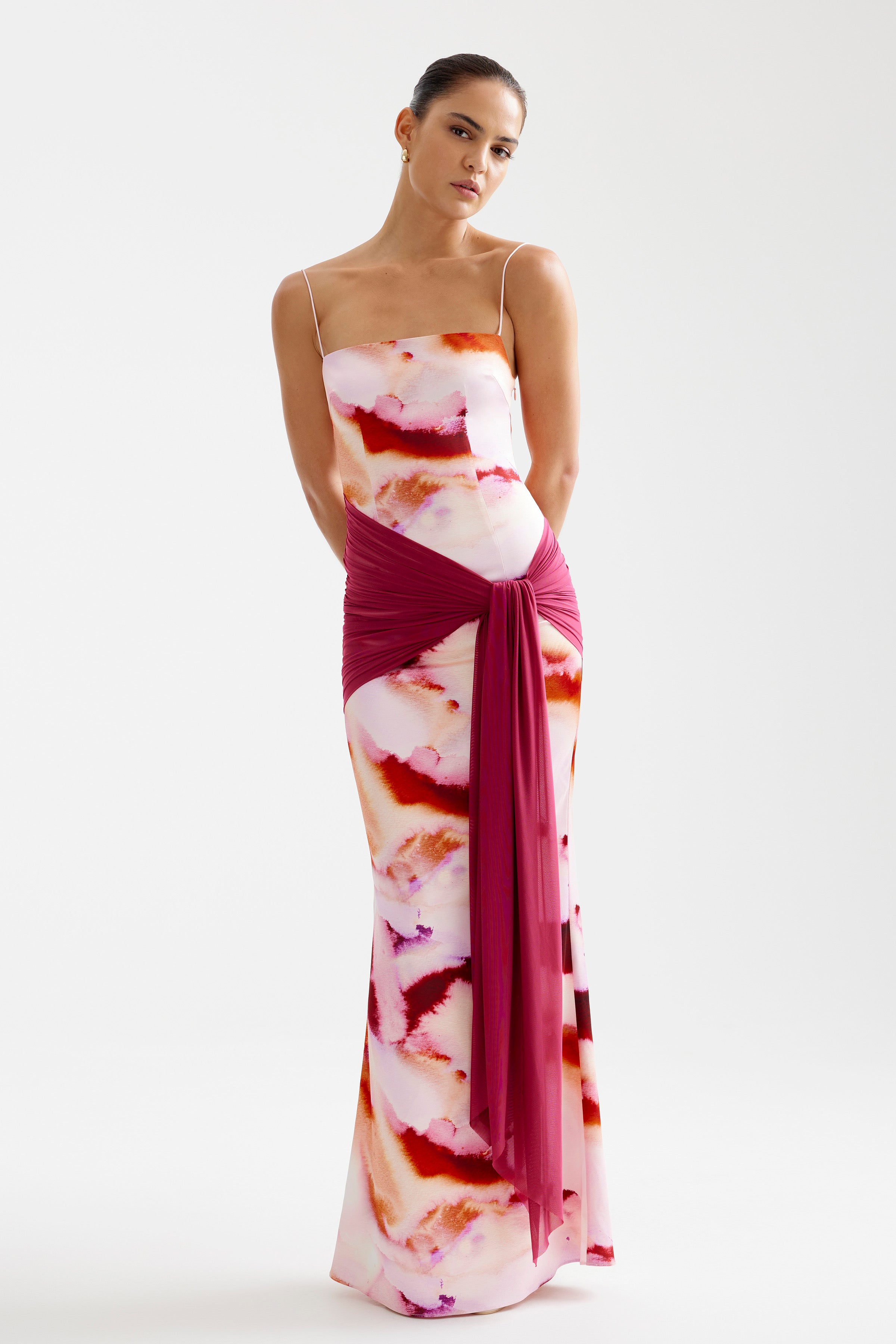 Ayla Dress featuring a fitted silhouette with delicate thin straps and a draped sash in pink mineral print for formal occasions