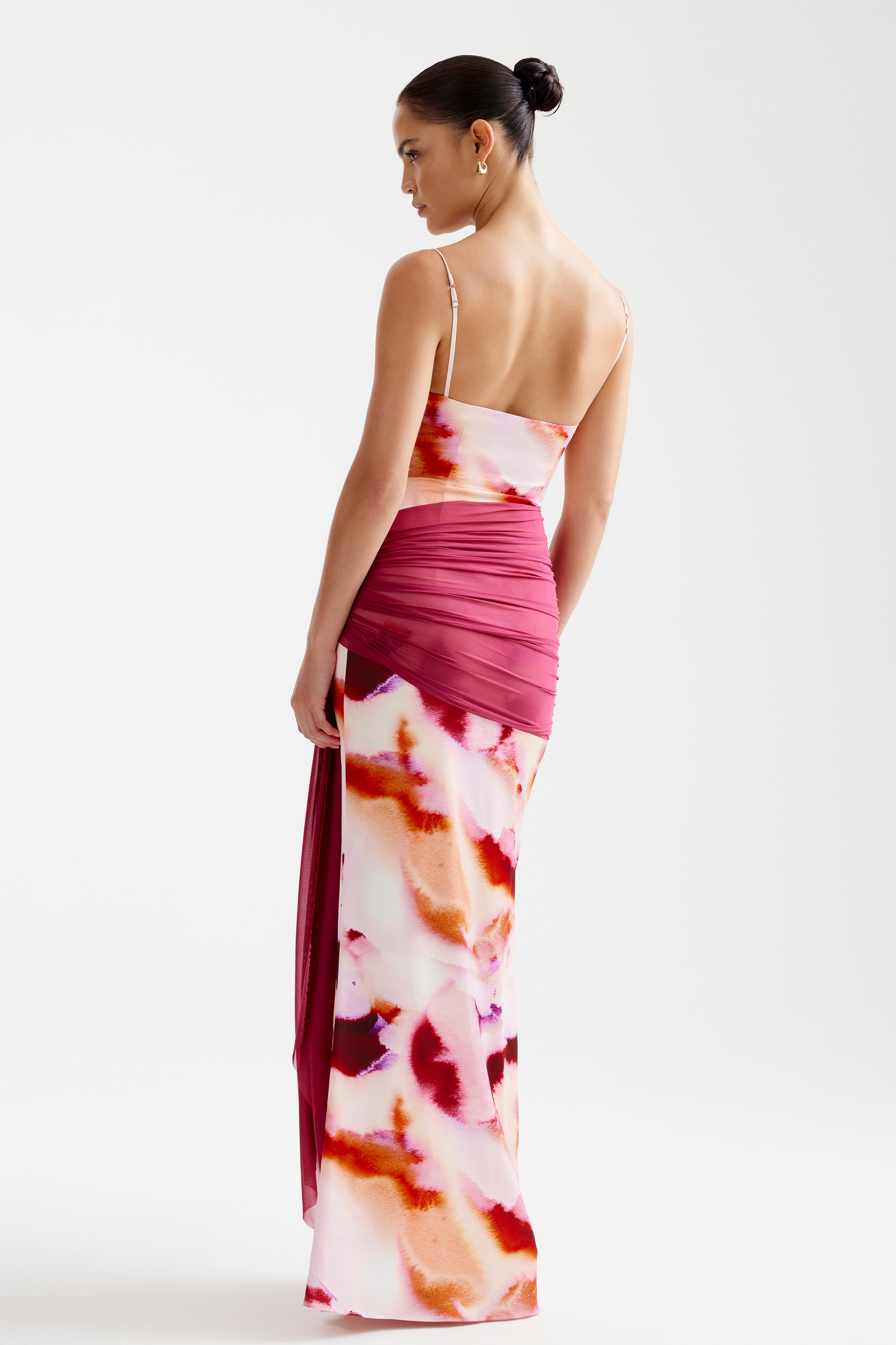 Ayla Dress featuring a backless silhouette with ruched detail and pink mineral print for formal occasions