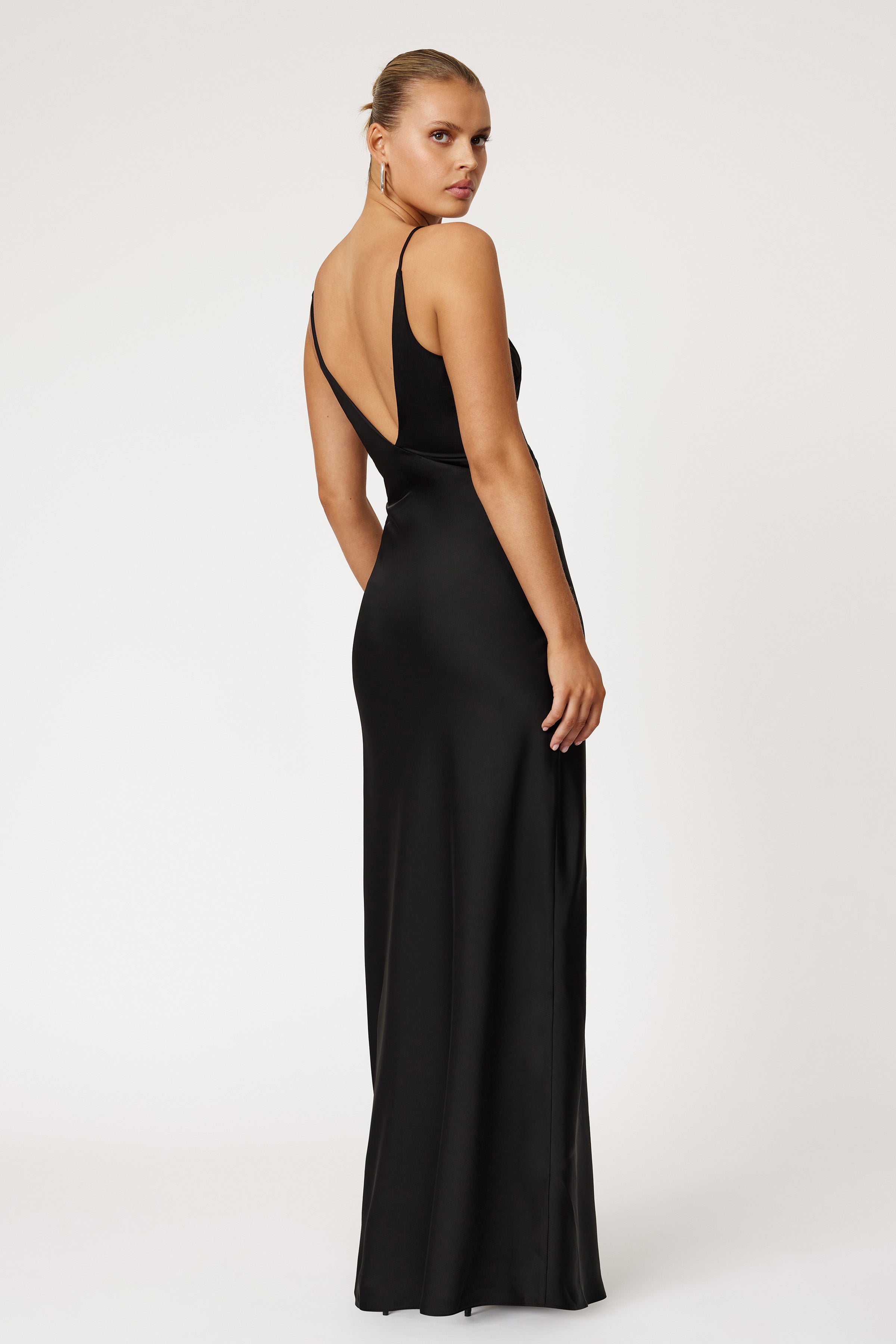 Bondi Dress featuring a sleek silhouette with a low back and thin straps in elegant black for formal events