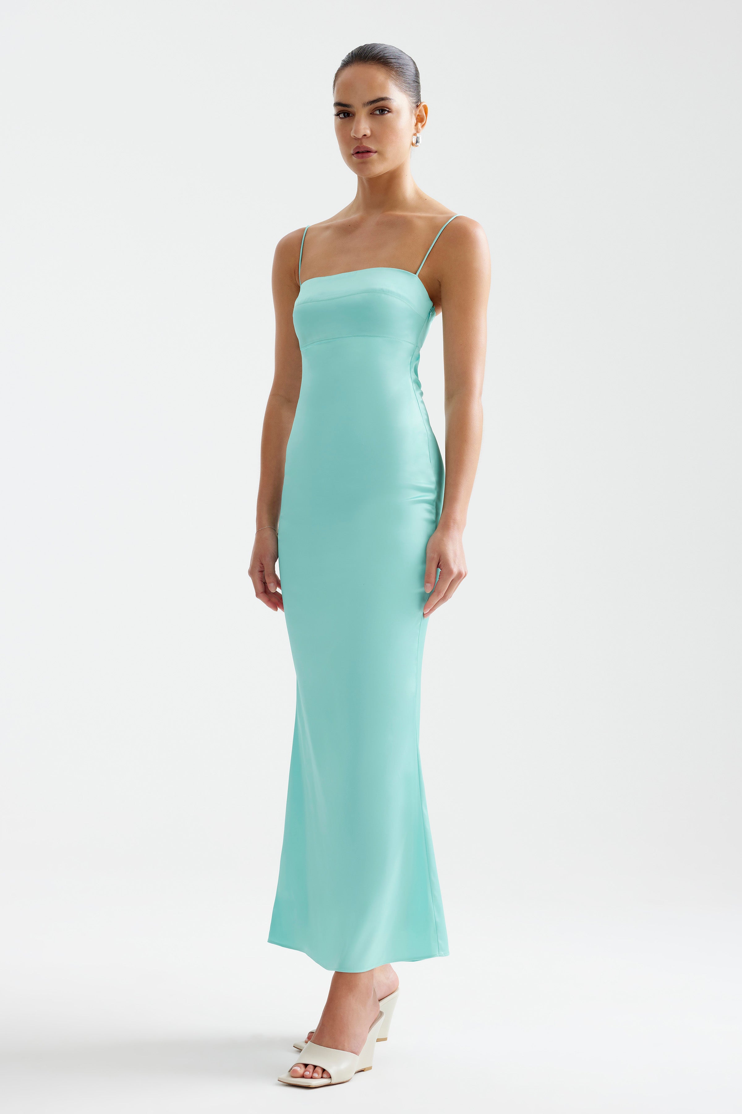 Bora Dress featuring a sleek fitted silhouette with thin straps in aqua for formal and cocktail occasions by Studio Lexi