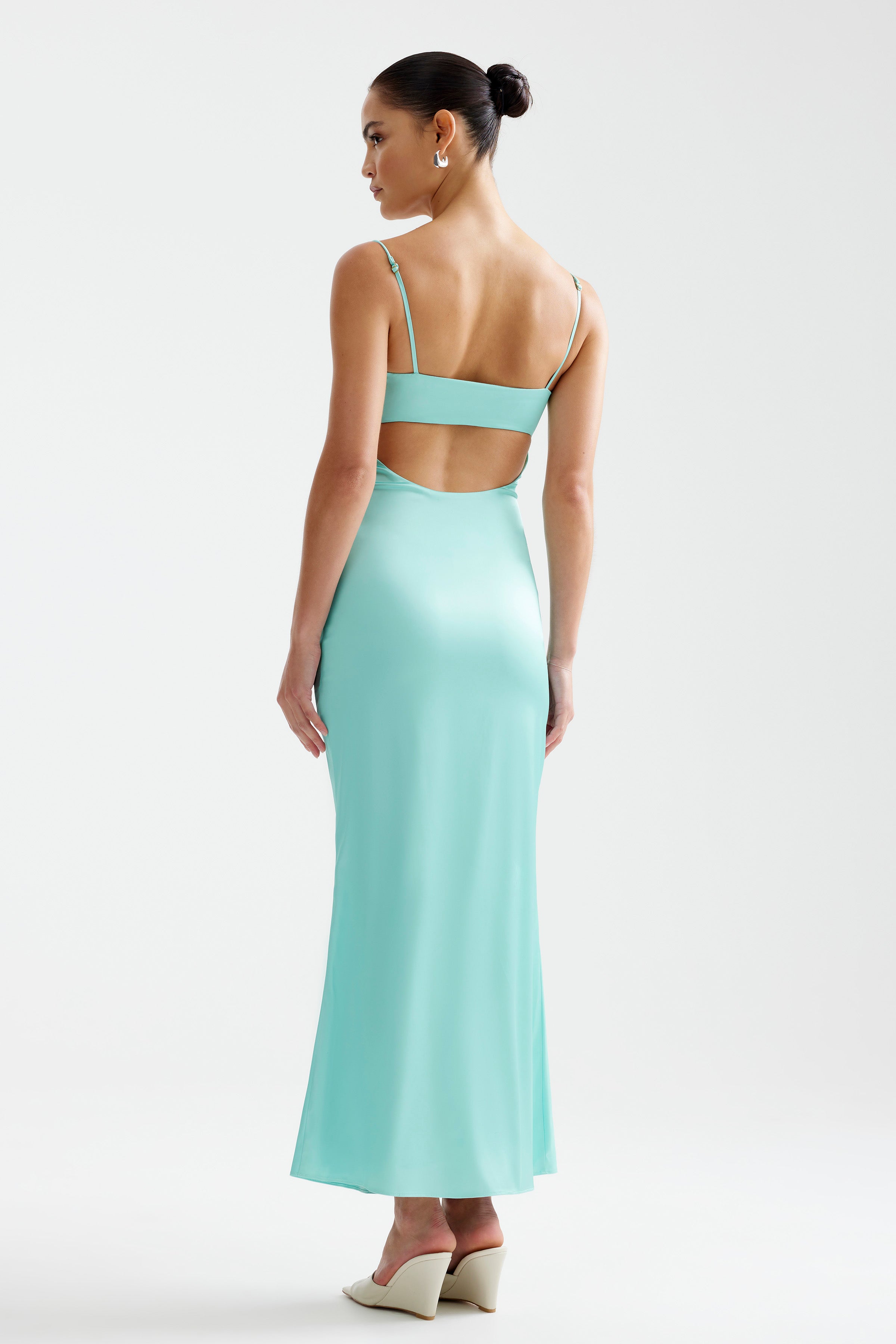 Bora Dress featuring a backless design with adjustable straps in vibrant aqua for formal and party occasions by Studio Lexi