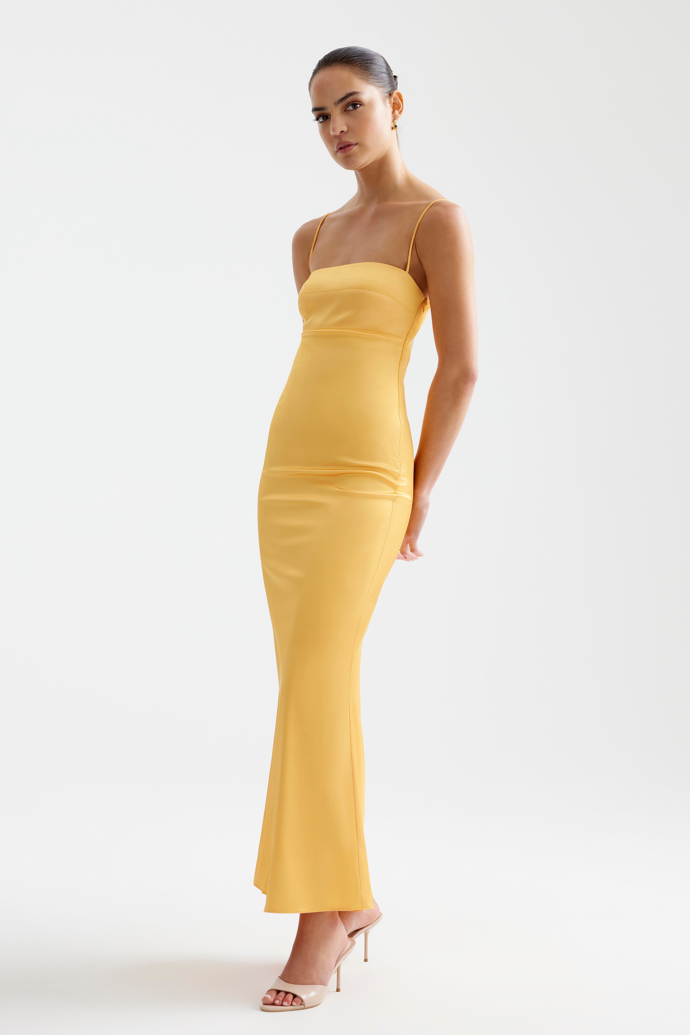 Bora Dress in papaya featuring a slim silhouette with thin straps for cocktail and formal occasions by Studio Lexi