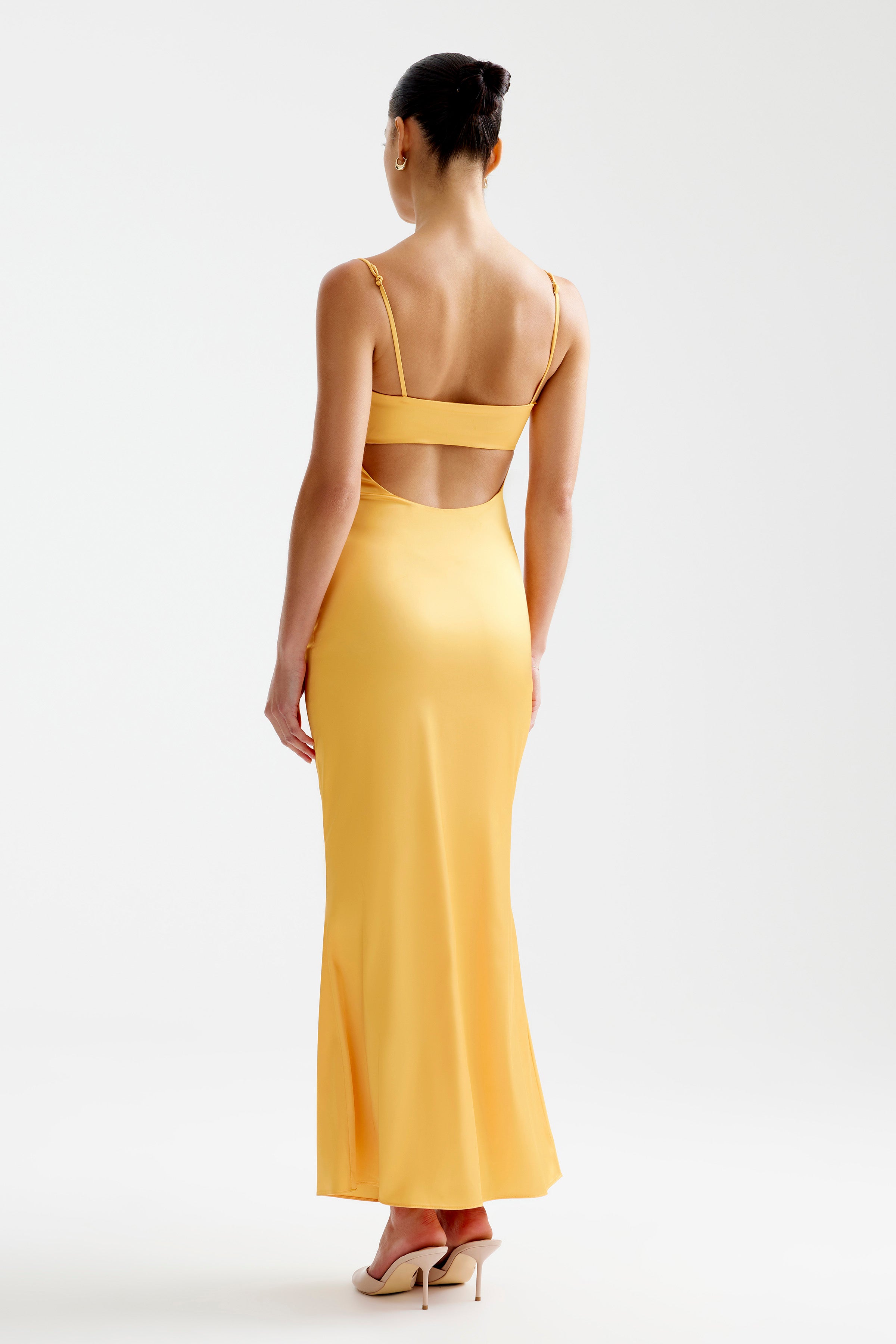 Bora Dress featuring a sleek back cutout and adjustable straps in papaya for cocktail and formal events by Studio Lexi