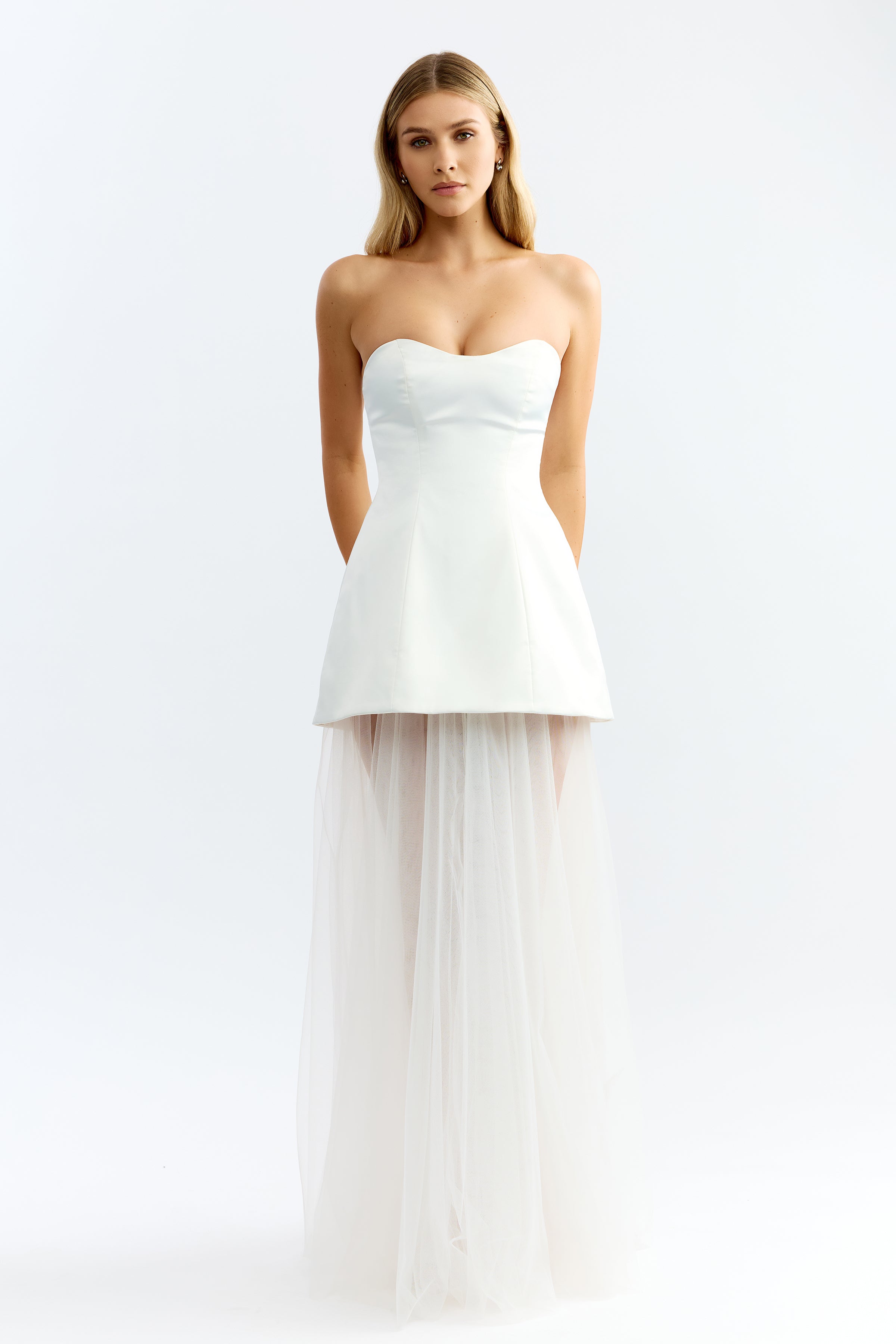 Brigitte Dress featuring a strapless fitted bodice with a sheer tulle skirt in ivory for formal black tie events