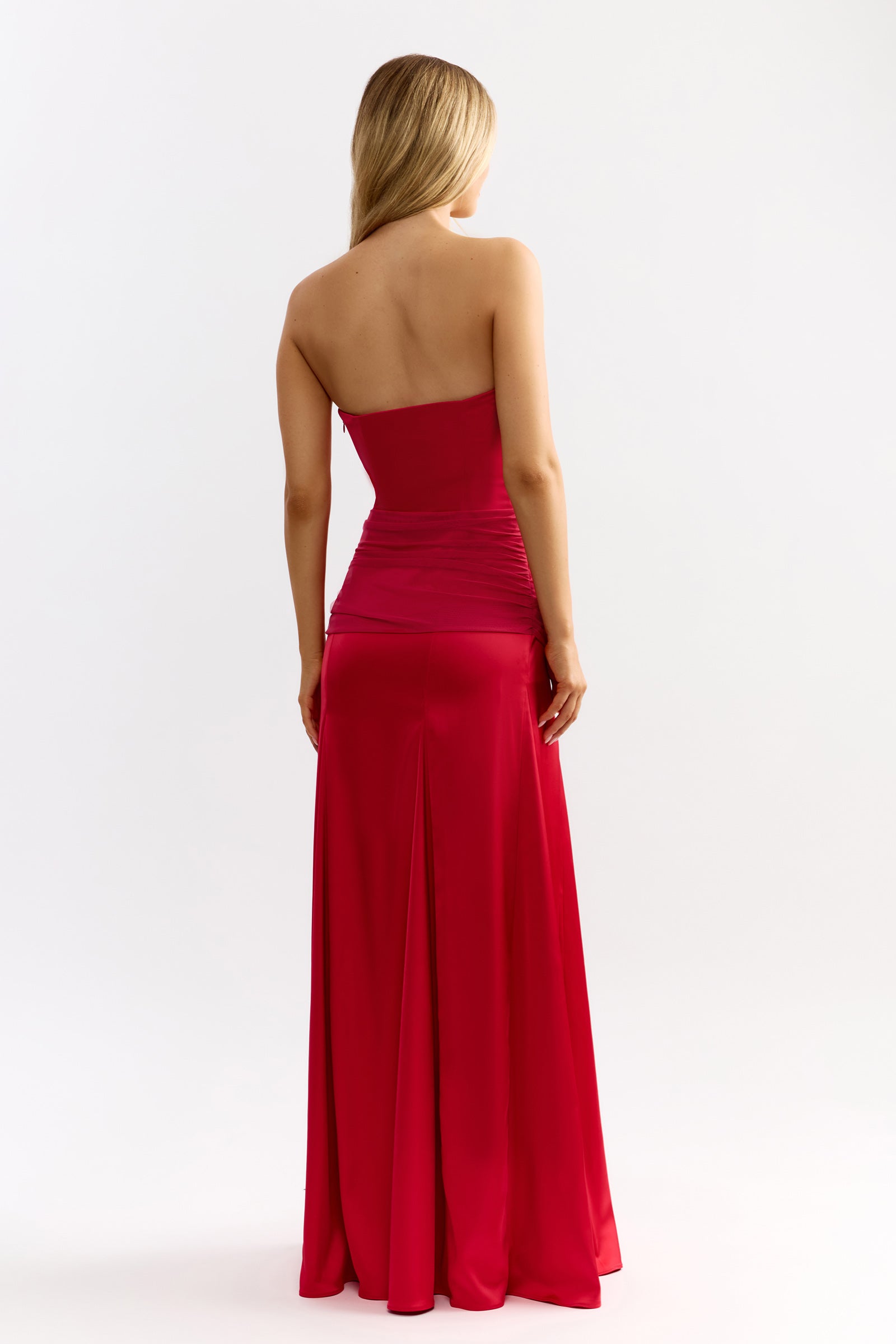 Celine Dress strapless backless design with ruched midsection and flowing skirt in vibrant raspberry by Studio Lexi