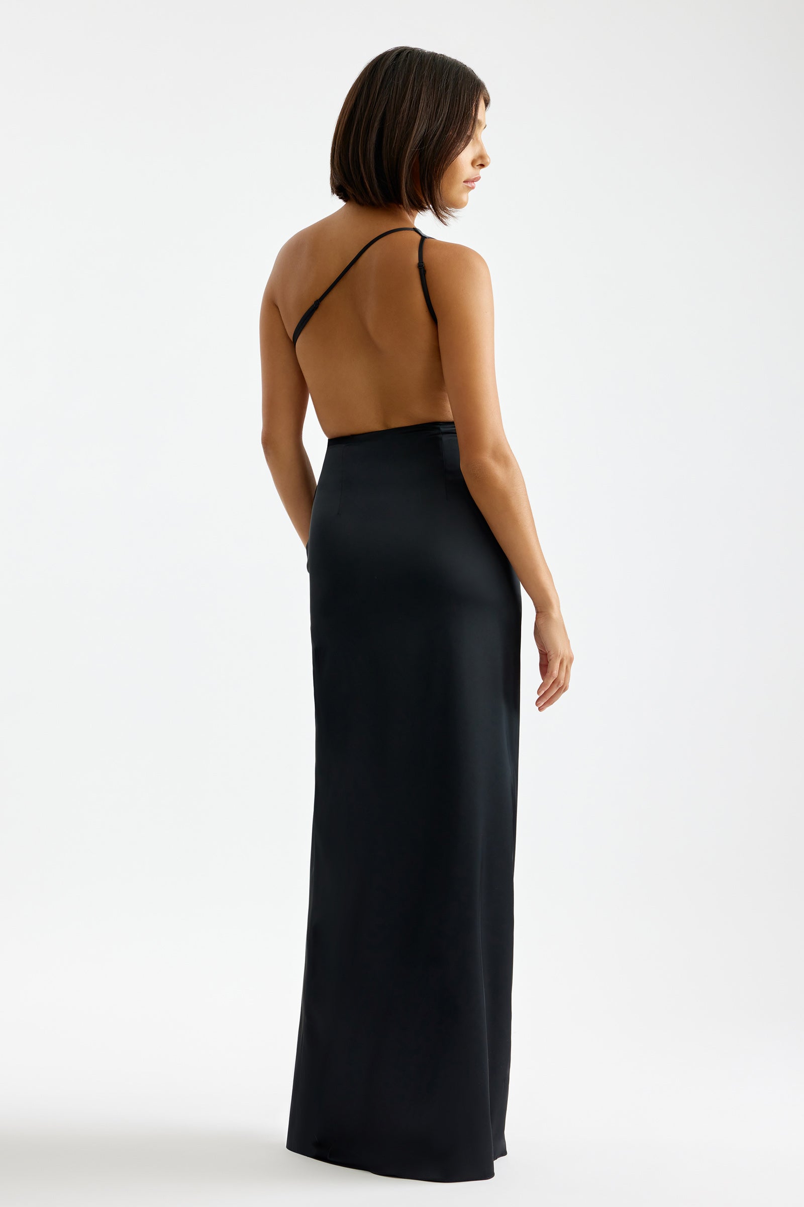 Clea Dress featuring backless design with thin straps and sleek silhouette in black for formal and black tie occasions by Studio Lexi