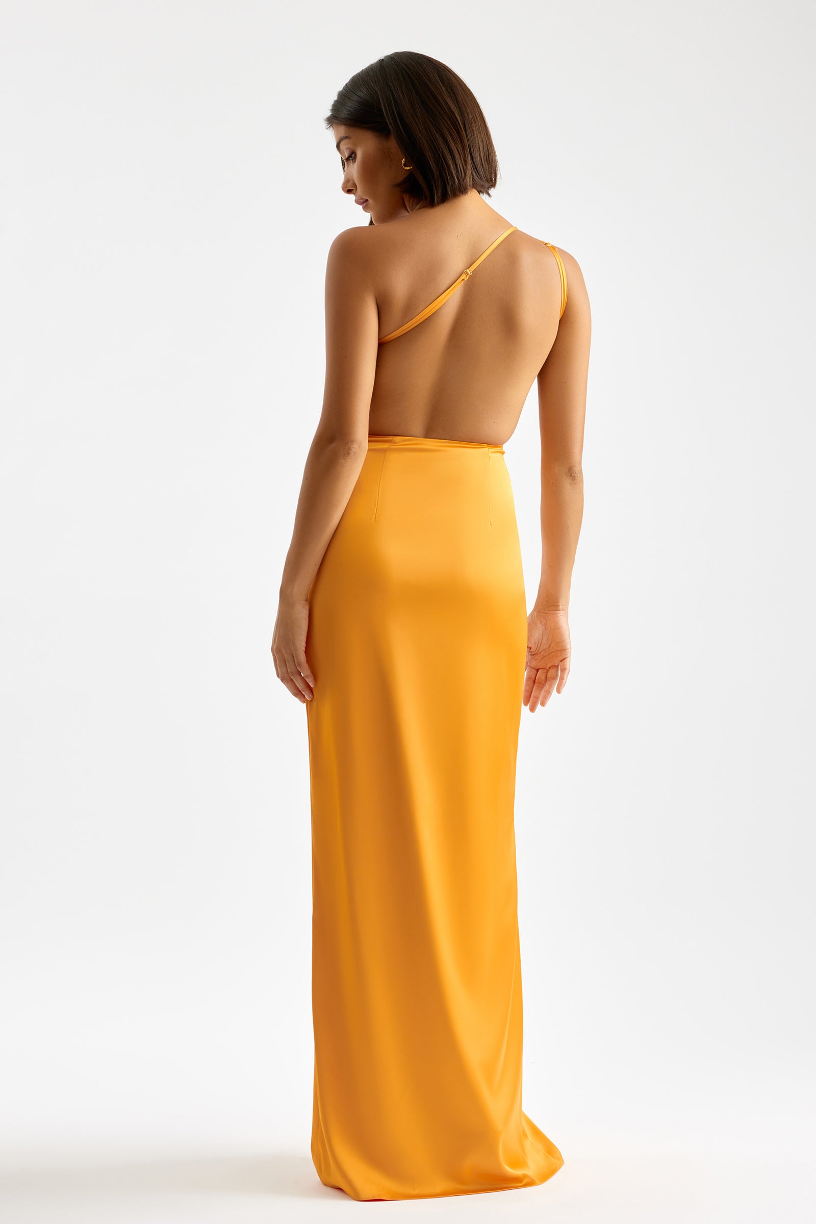 Clea Dress with backless design and single shoulder strap in vibrant orange for formal and black tie occasions by Studio Lexi