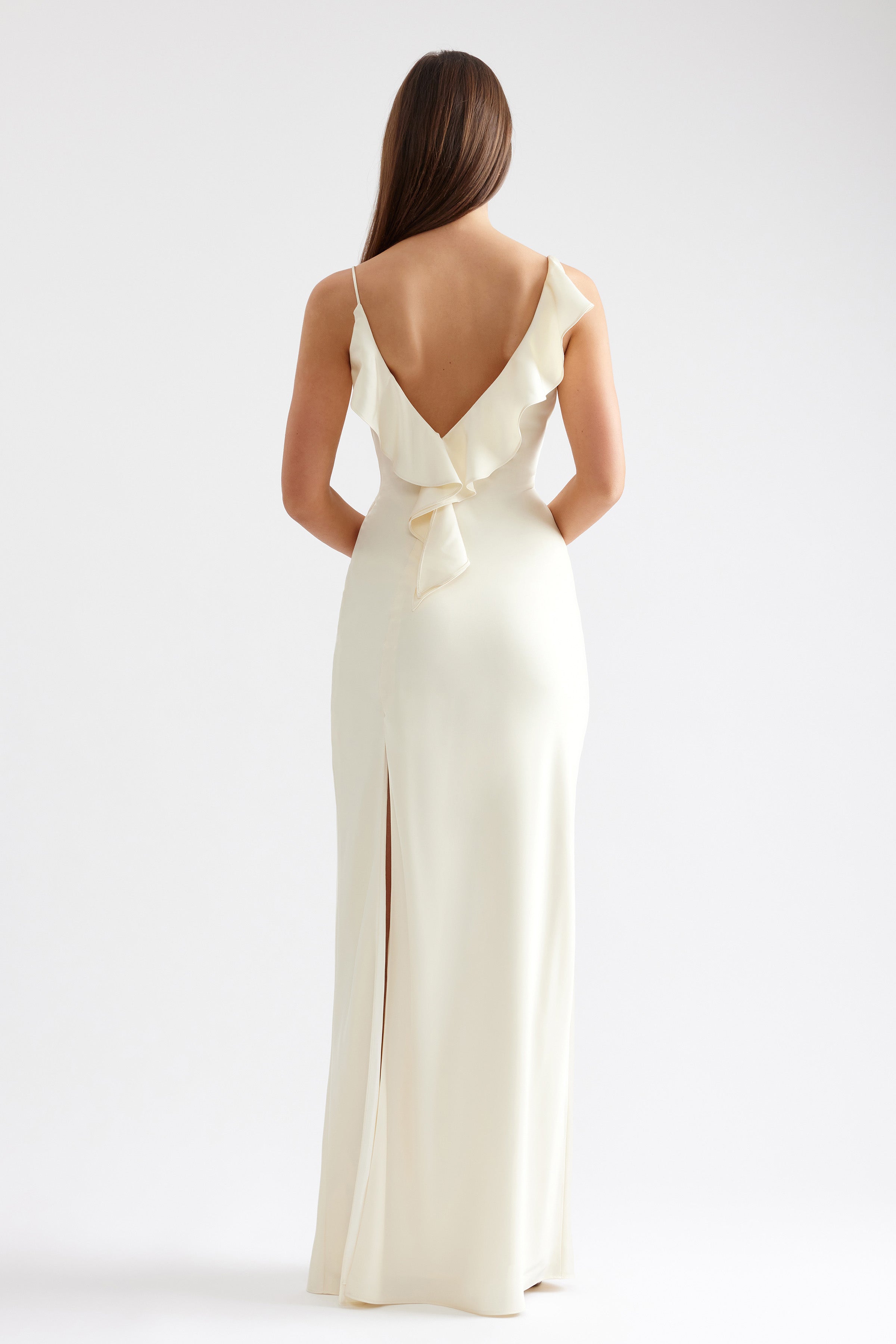 Diana Dress with low back, ruffle detail and back slit in butter cream for formal and black tie occasions by Studio Lexi