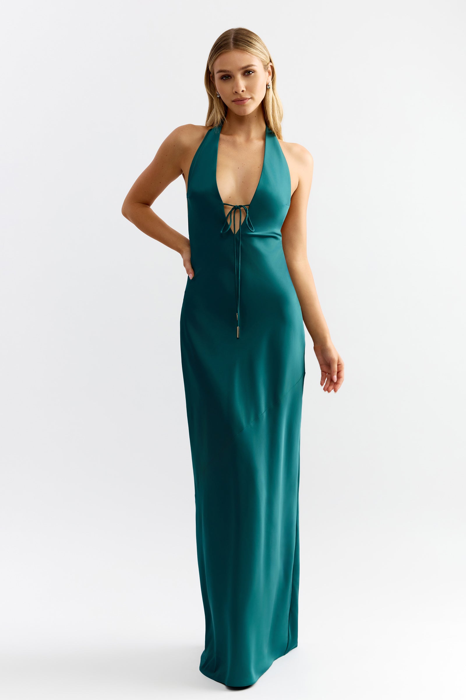 Diaz Dress featuring a halter neckline with front tie detail in deep emerald satin for formal occasions by Studio Lexi