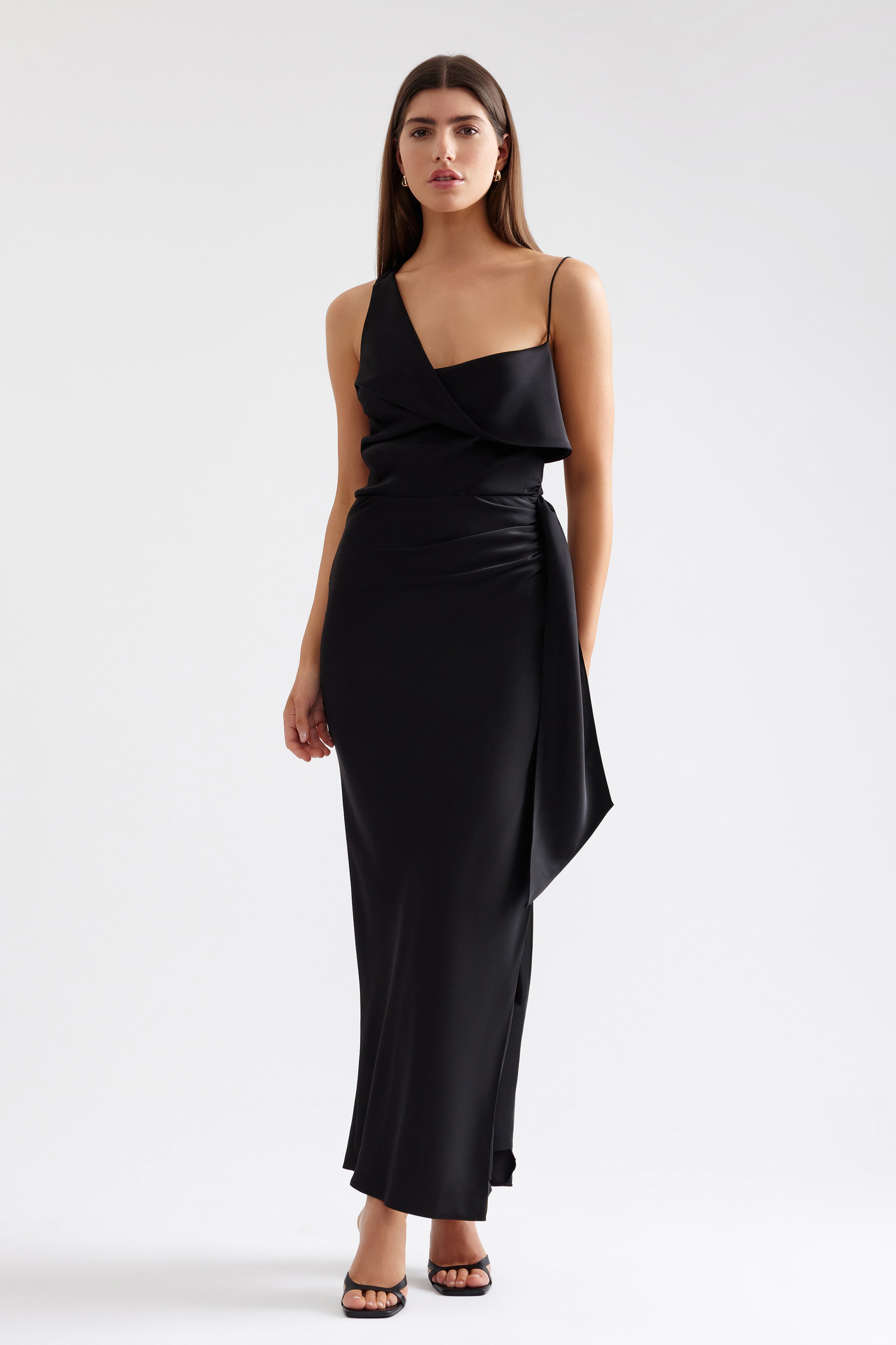 Elizabeth Dress black fitted design with asymmetric neckline, slim straps, and side drape detail for formal and evening occasions by Studio Lexi