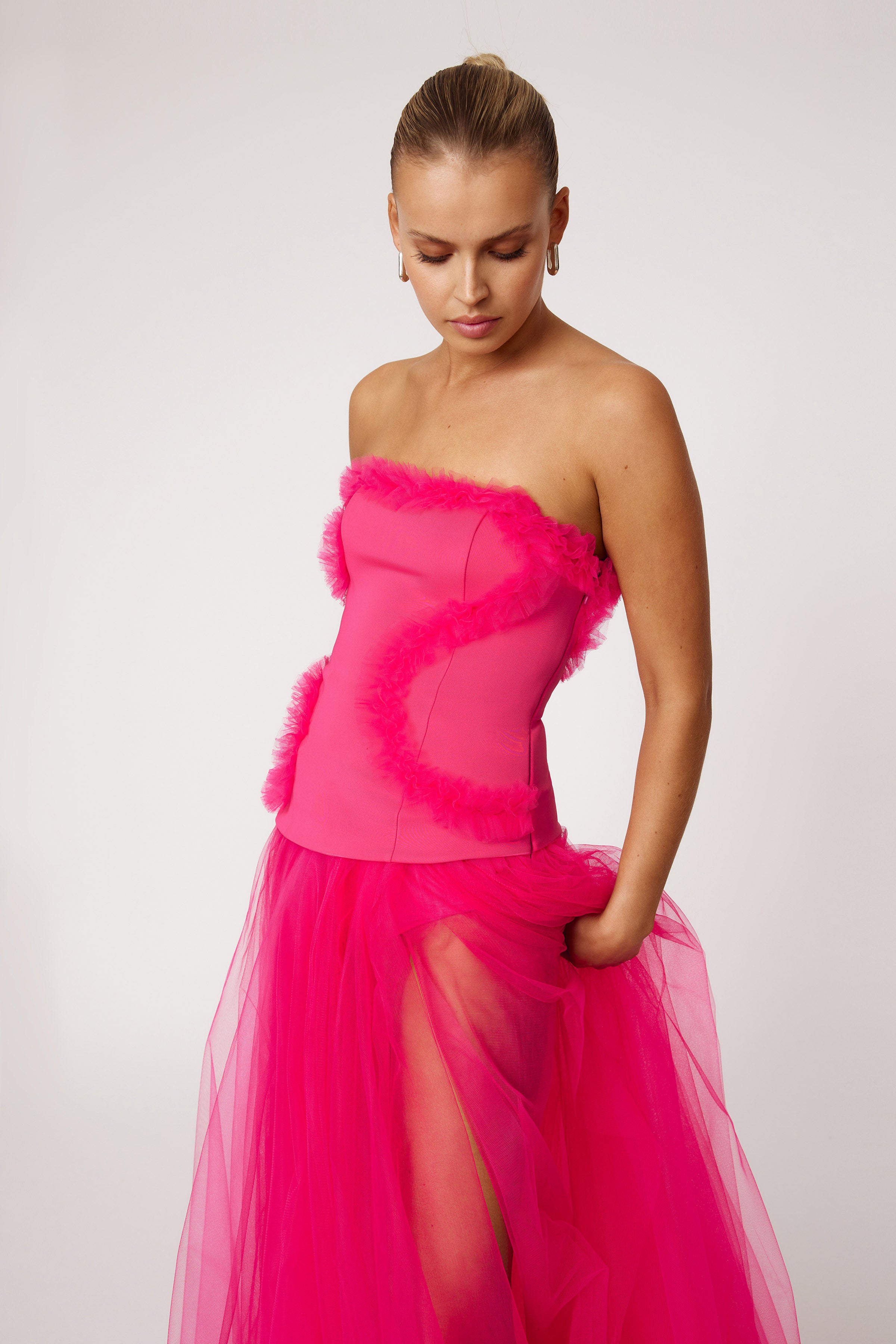 Emilie Dress strapless fitted bodice with sheer tulle skirt and high split in raspberry for formal and black tie occasions by Studio Lexi