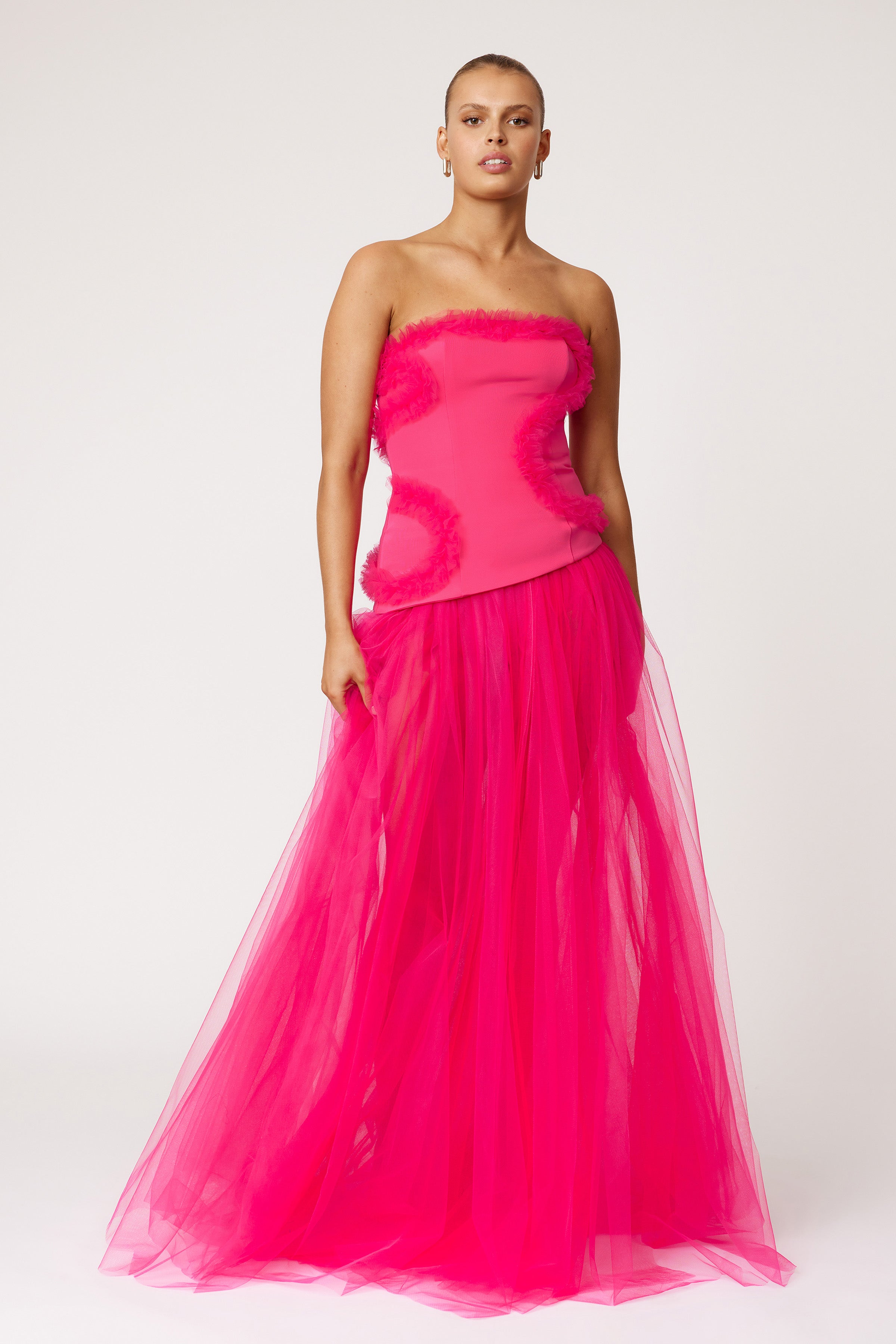Emilie Dress strapless silhouette with textured bodice and flowing tulle skirt in vibrant raspberry by Studio Lexi