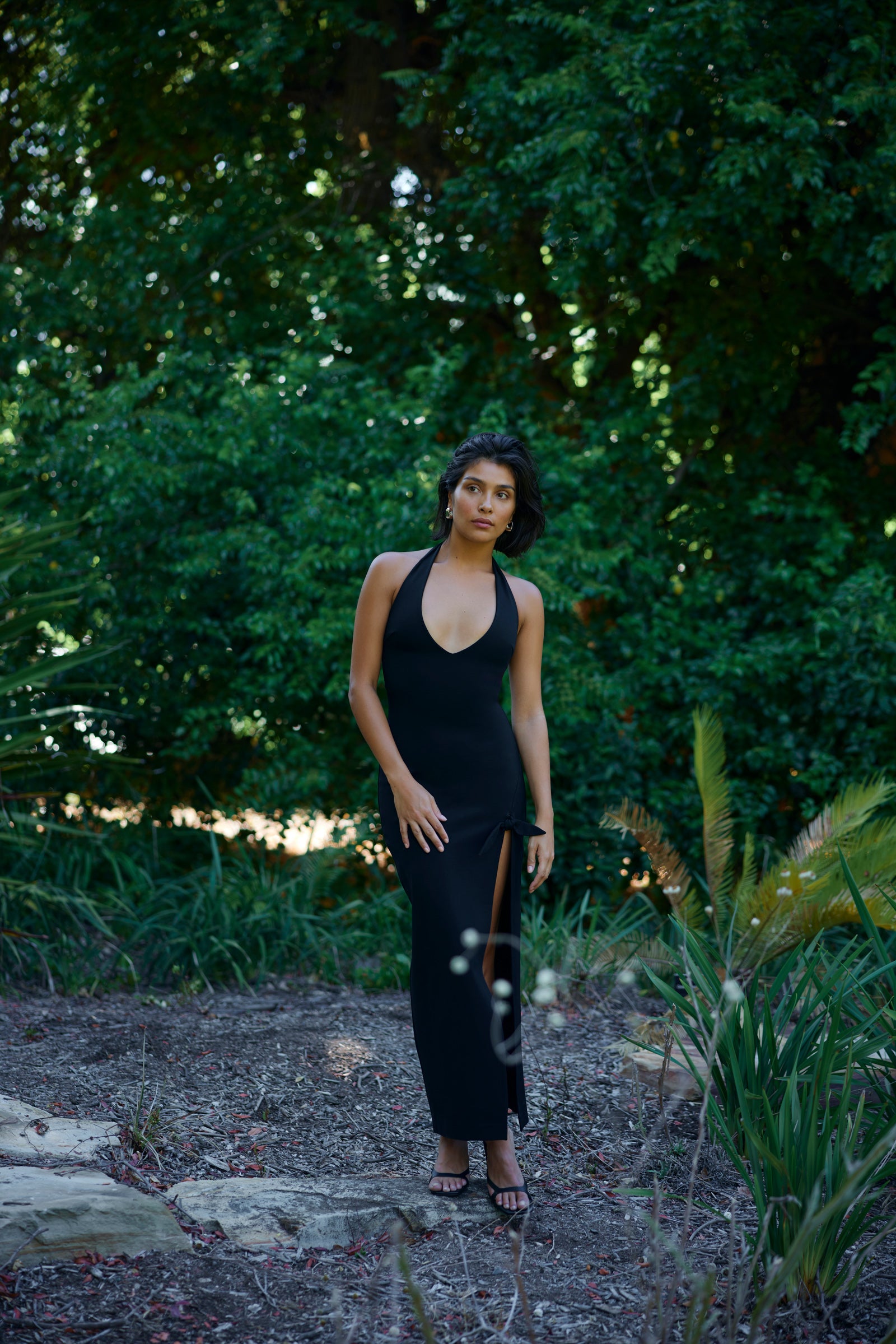 Evana Dress sleek halter neckline with side split in black for evening and cocktail occasions by Studio Lexi