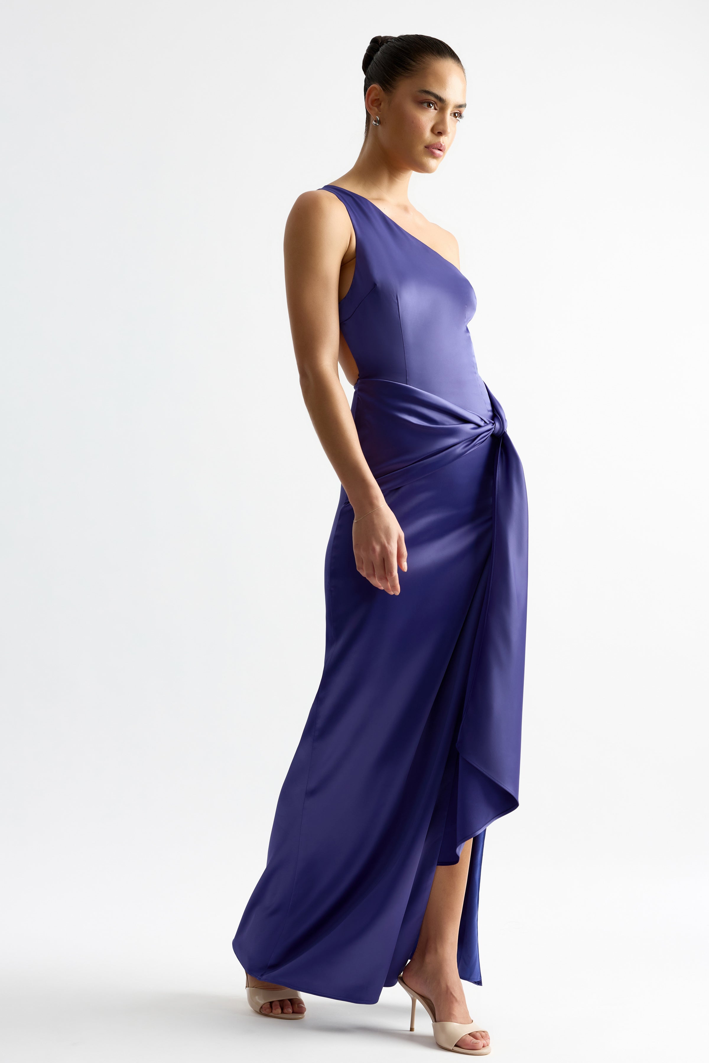 Fabienne Dress featuring a one-shoulder design and knotted drape detail in indigo satin by Studio Lexi