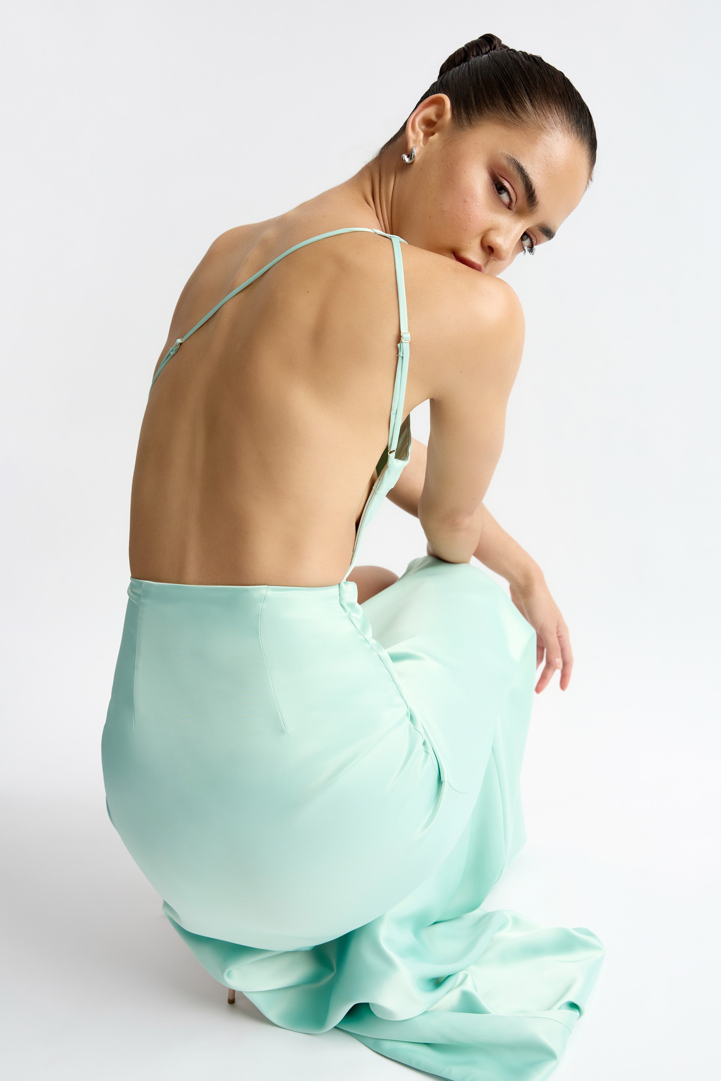 Fabienne Dress featuring a backless design and adjustable straps in mint for elegant occasion wear by Studio Lexi