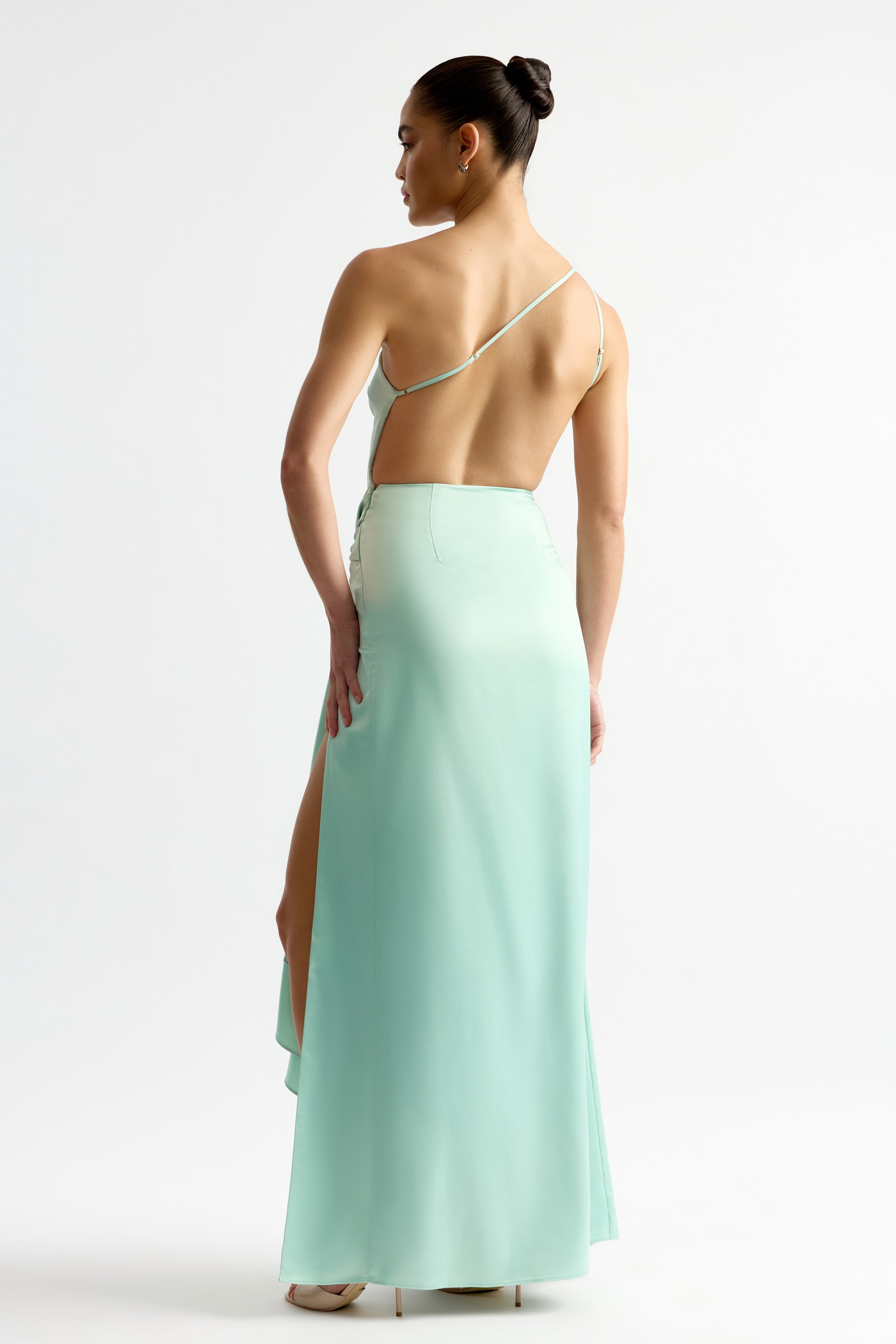 Fabienne Dress featuring a one-shoulder strap and backless design in mint for elegant occasion wear by Studio Lexi