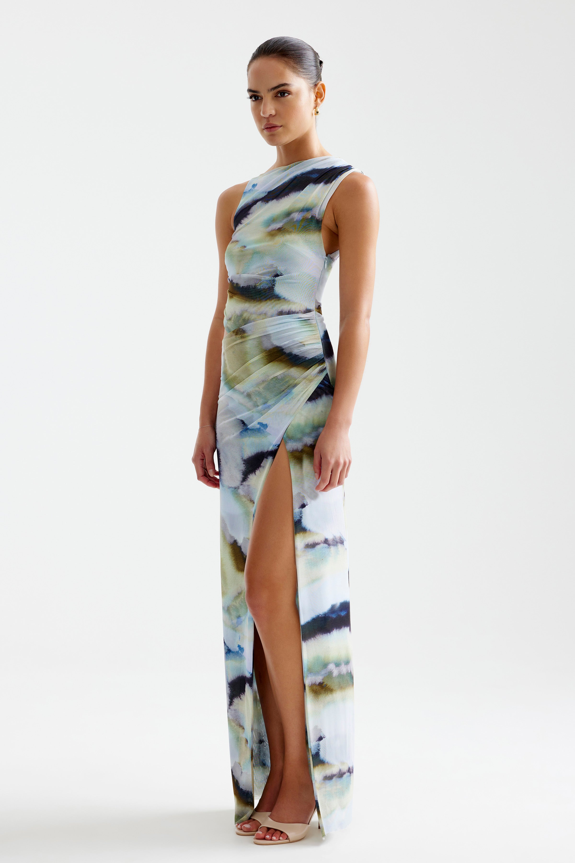 Fiora Dress featuring a sleeveless cut with side split in blue mineral print designed by Studio Lexi for formal occasions
