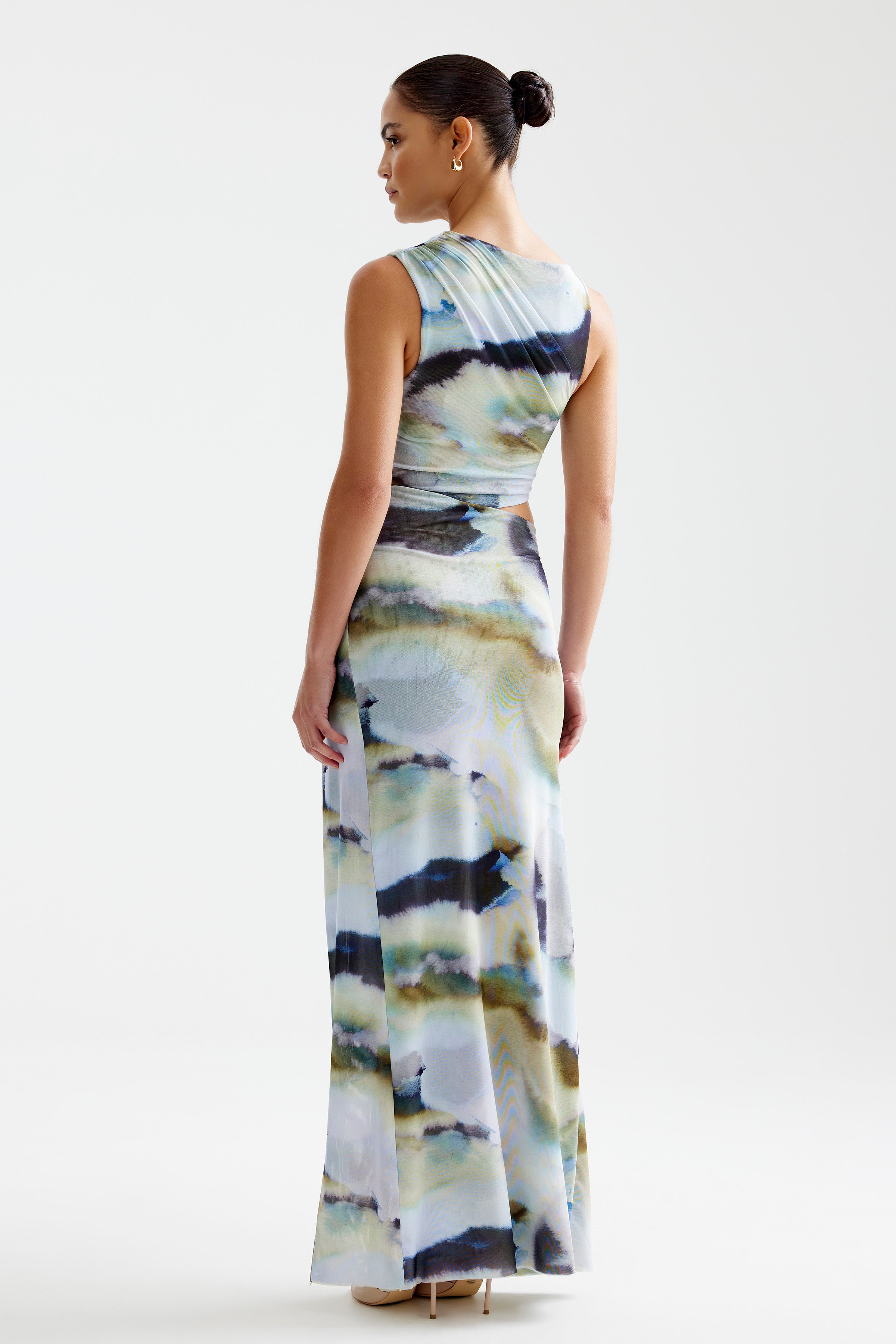 Fiora Dress featuring a sleeveless silhouette with a blue mineral print and floor-length fit by Studio Lexi