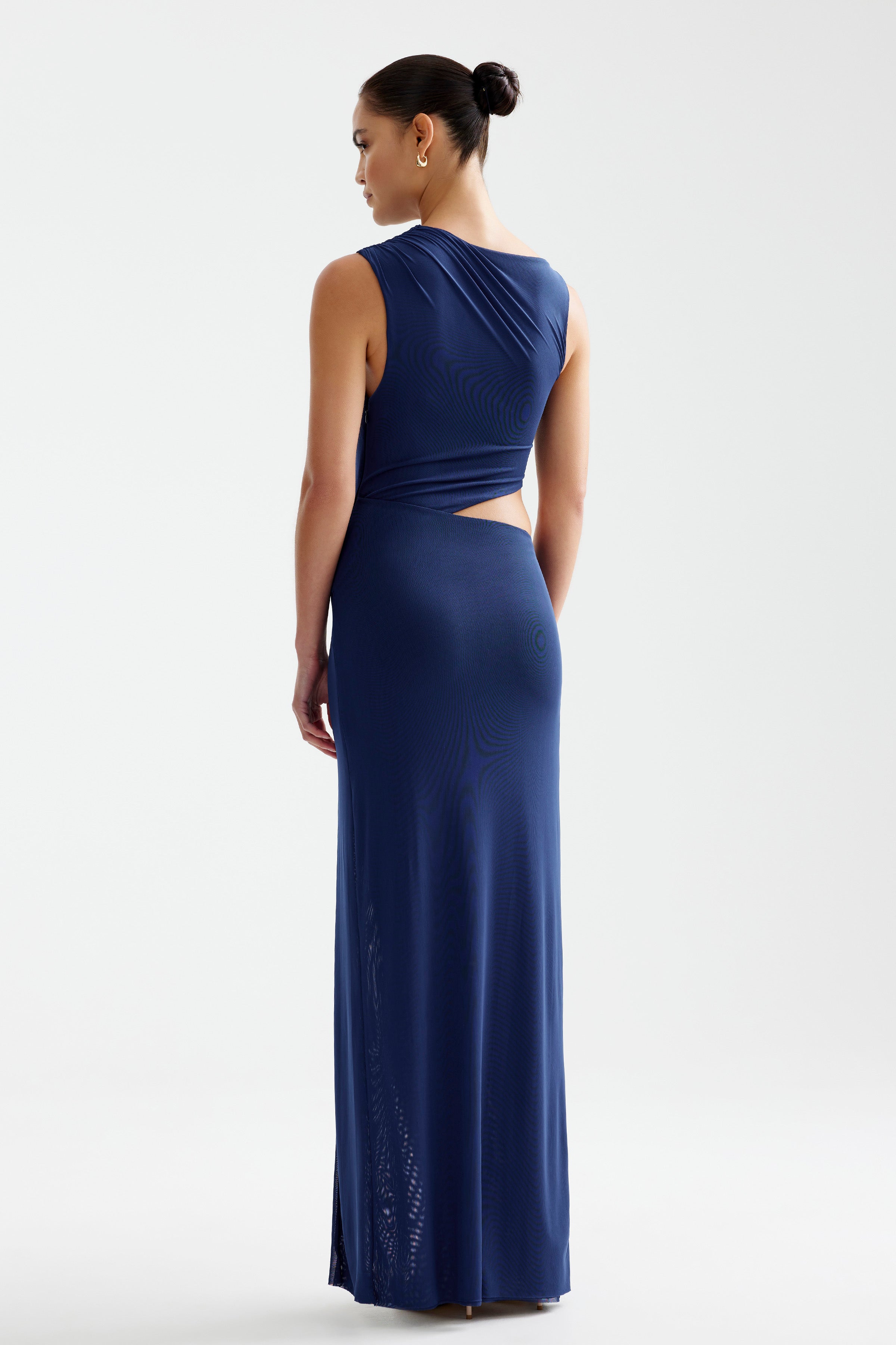 Fiora Dress featuring a sleeveless cut with a side cutout and floor-length silhouette in navy by Studio Lexi