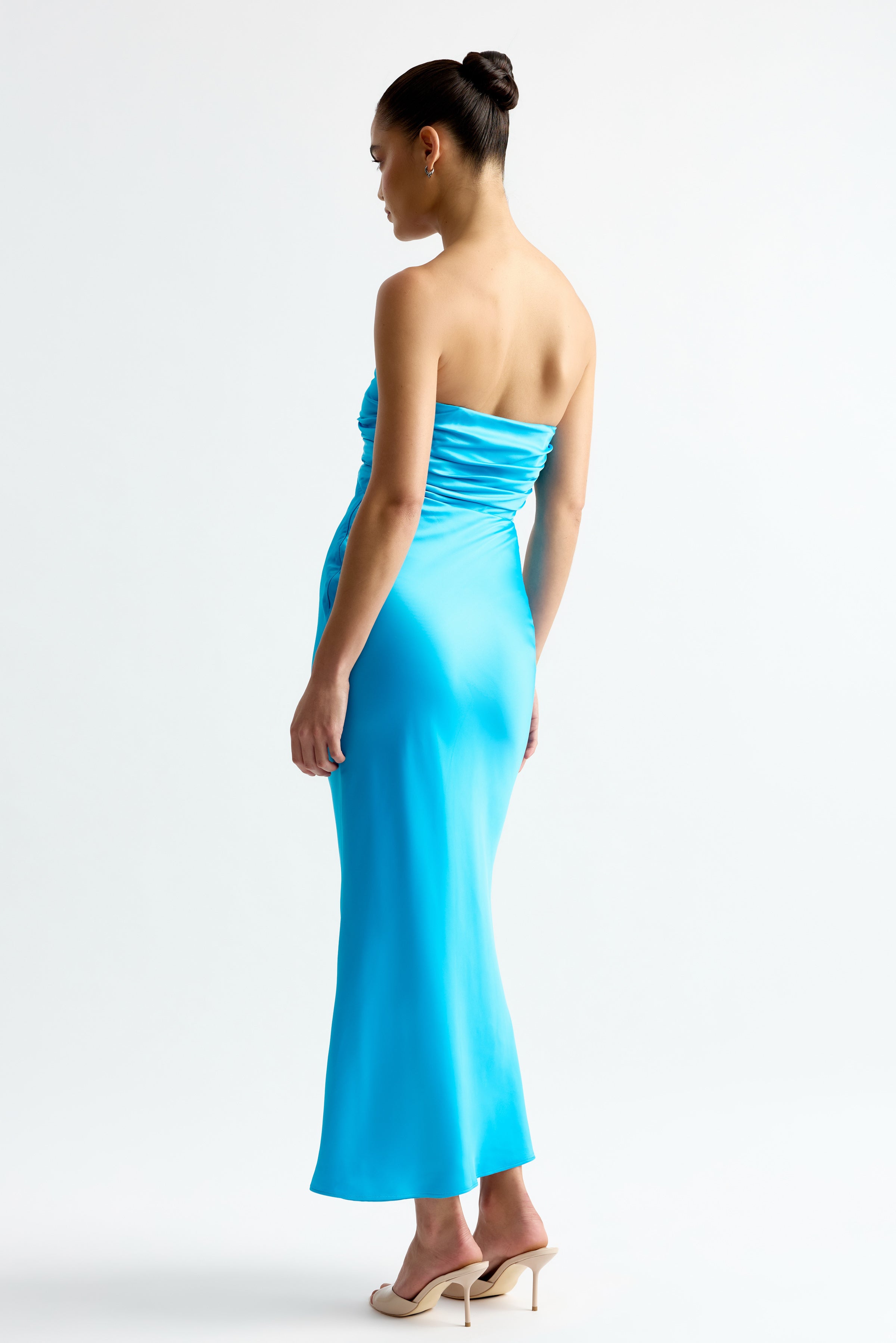 Geneva Dress featuring a strapless silhouette with ruched bodice in vibrant blue by Studio Lexi
