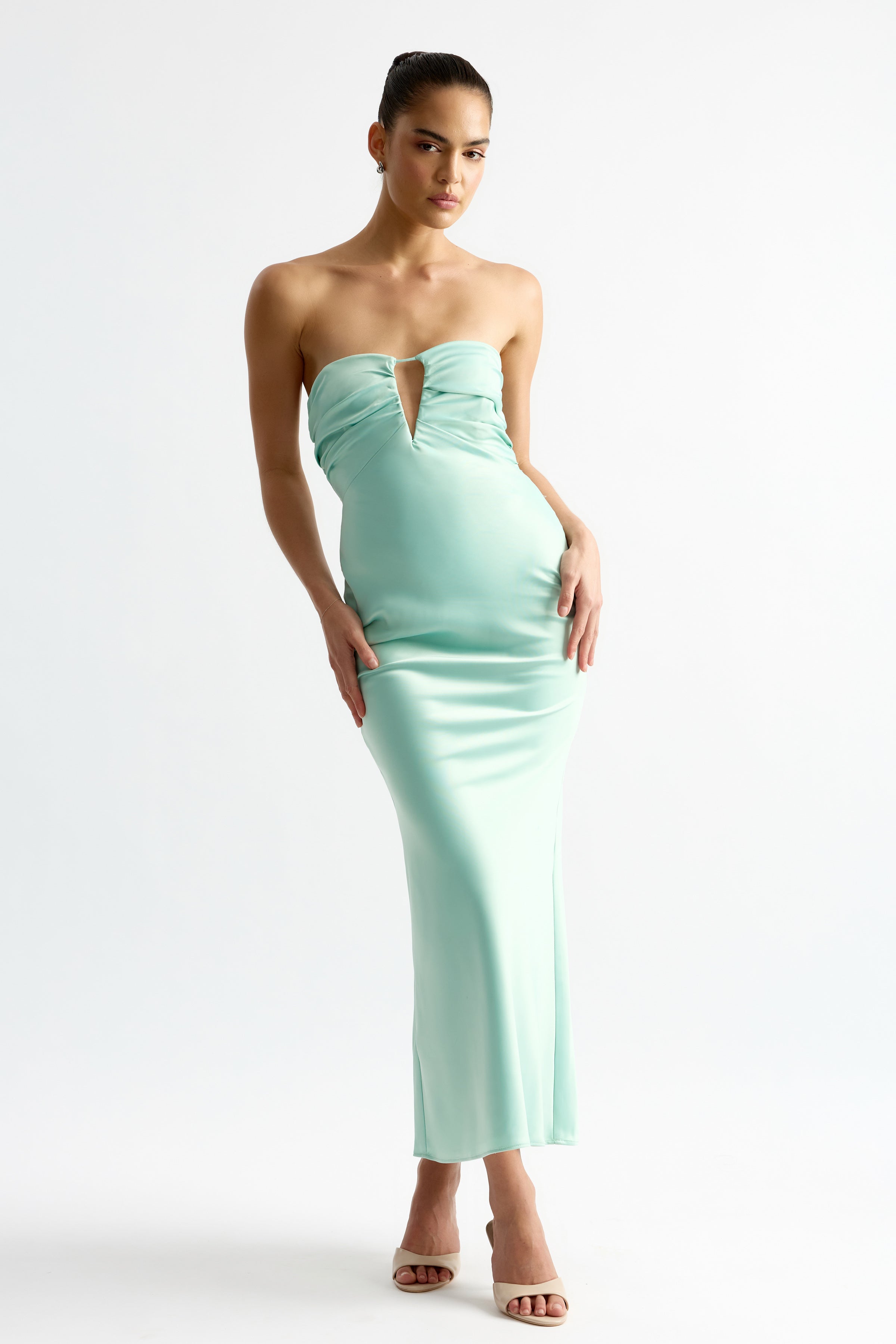 Geneva Dress featuring a strapless neckline with front cutout and sleek silhouette in mint by Studio Lexi