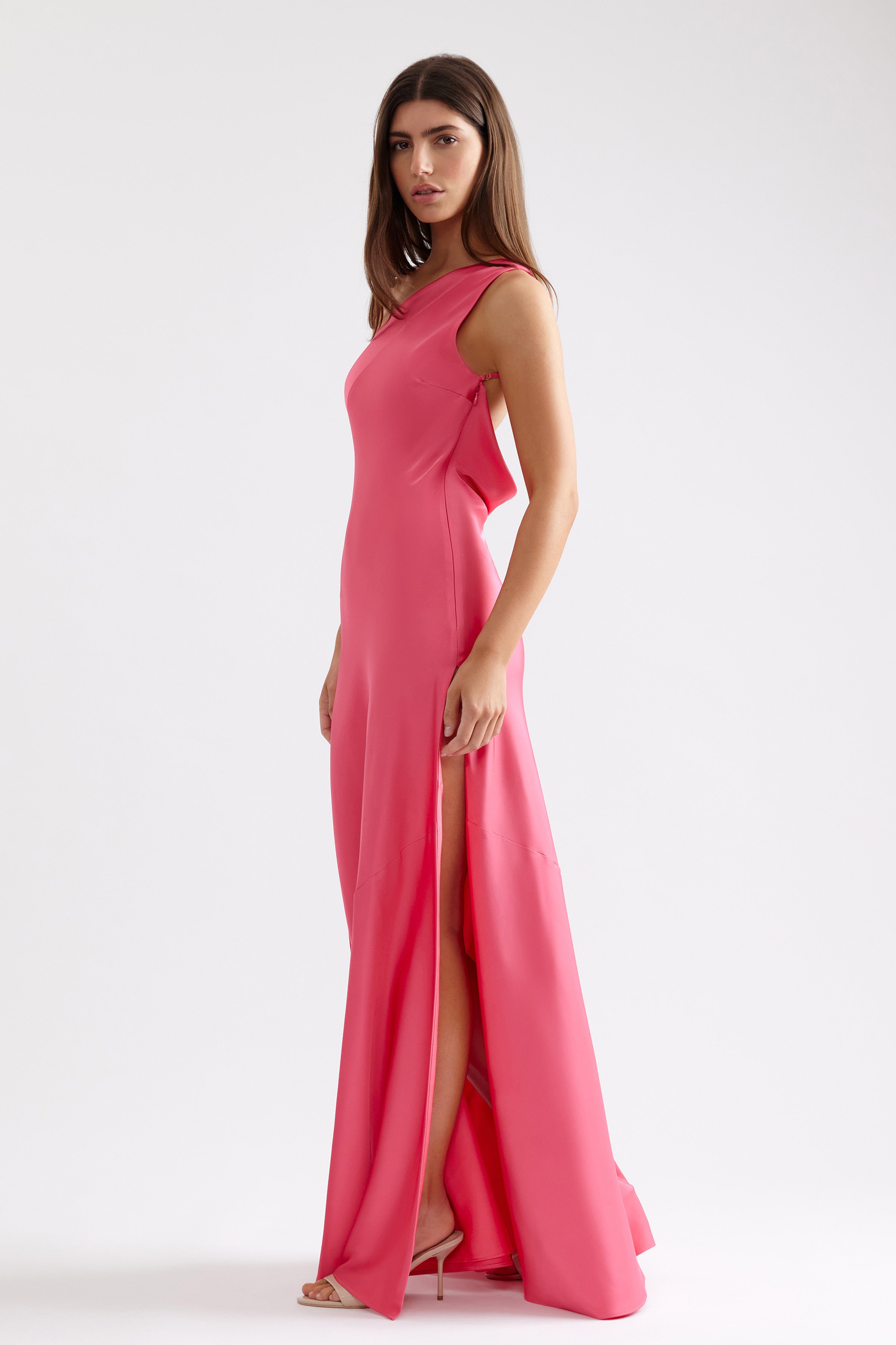 Gina Dress sleek silhouette with high split and backless detail in deep pink for formal and wedding guest occasions by Studio Lexi