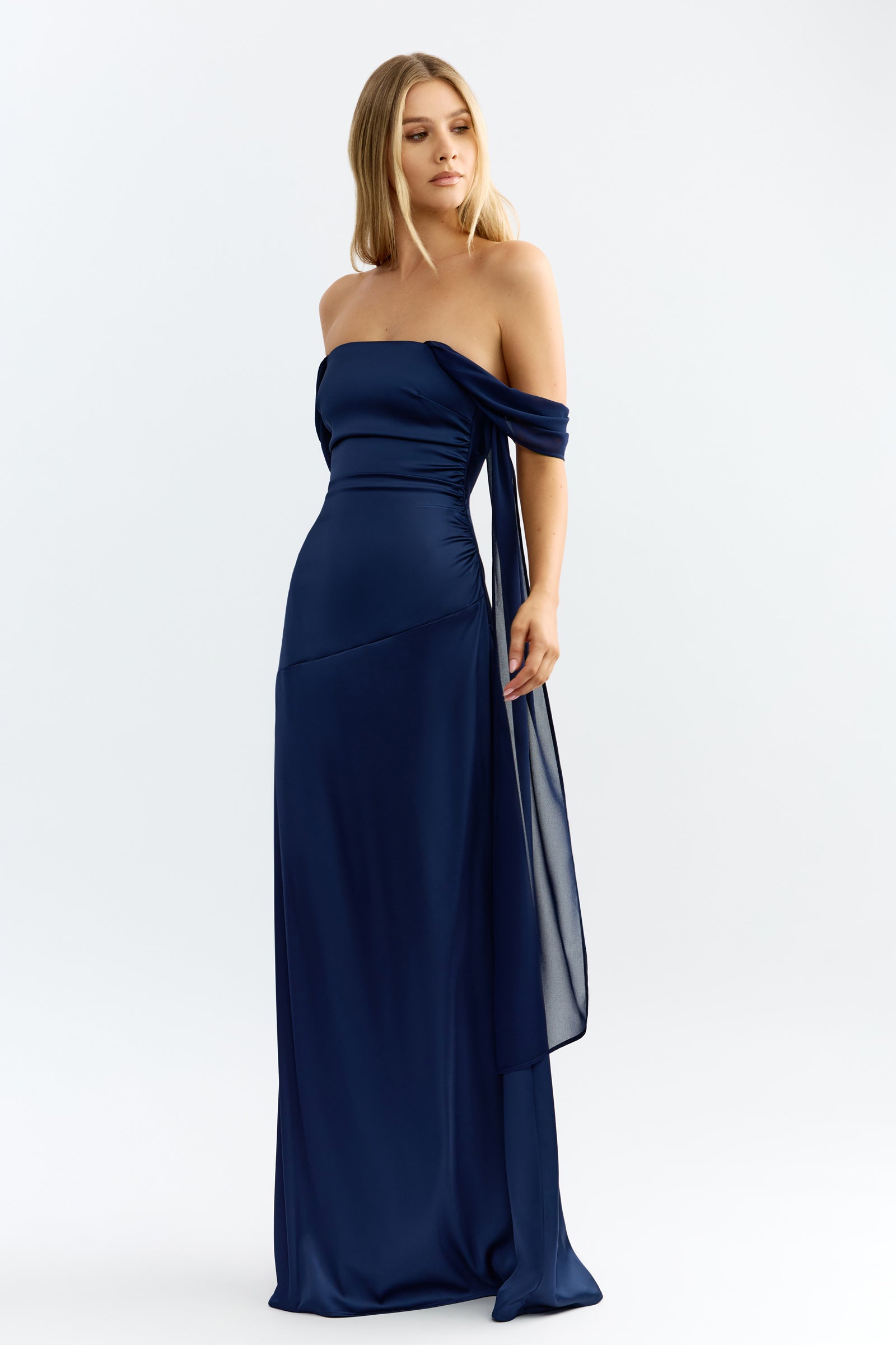 Hattie Dress featuring a strapless neckline with draped sleeve detail in midnight blue for formal occasions by Studio Lexi