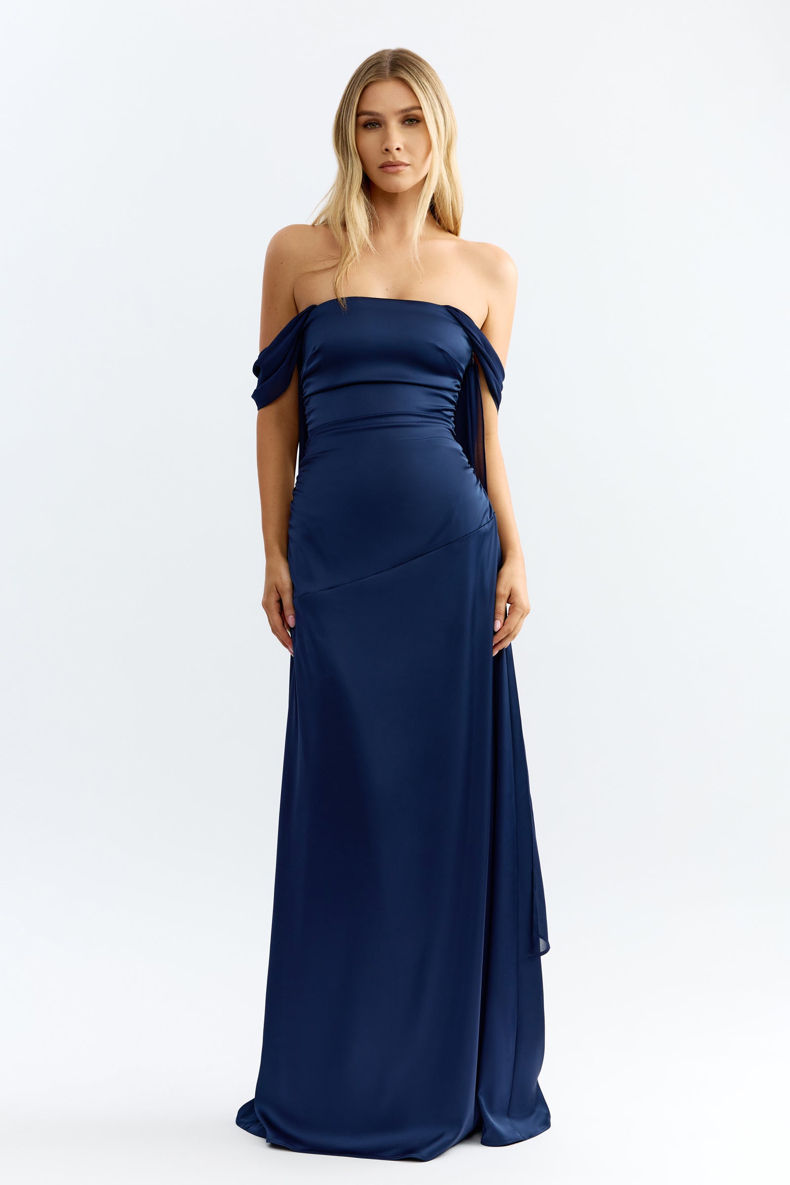 Hattie Dress featuring a strapless design with draped off-shoulder sleeves in midnight blue by Studio Lexi for formal events