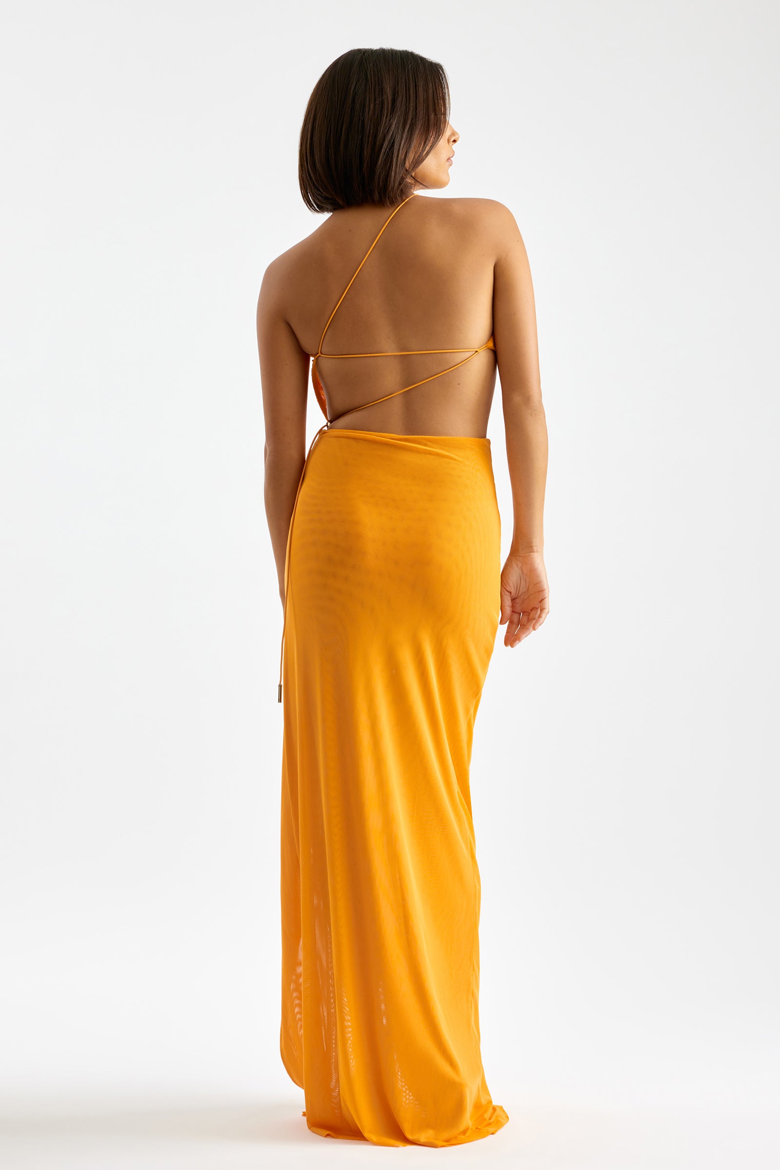 Havana Dress backless design with strappy open back and flowing silhouette in vibrant orange by Studio Lexi