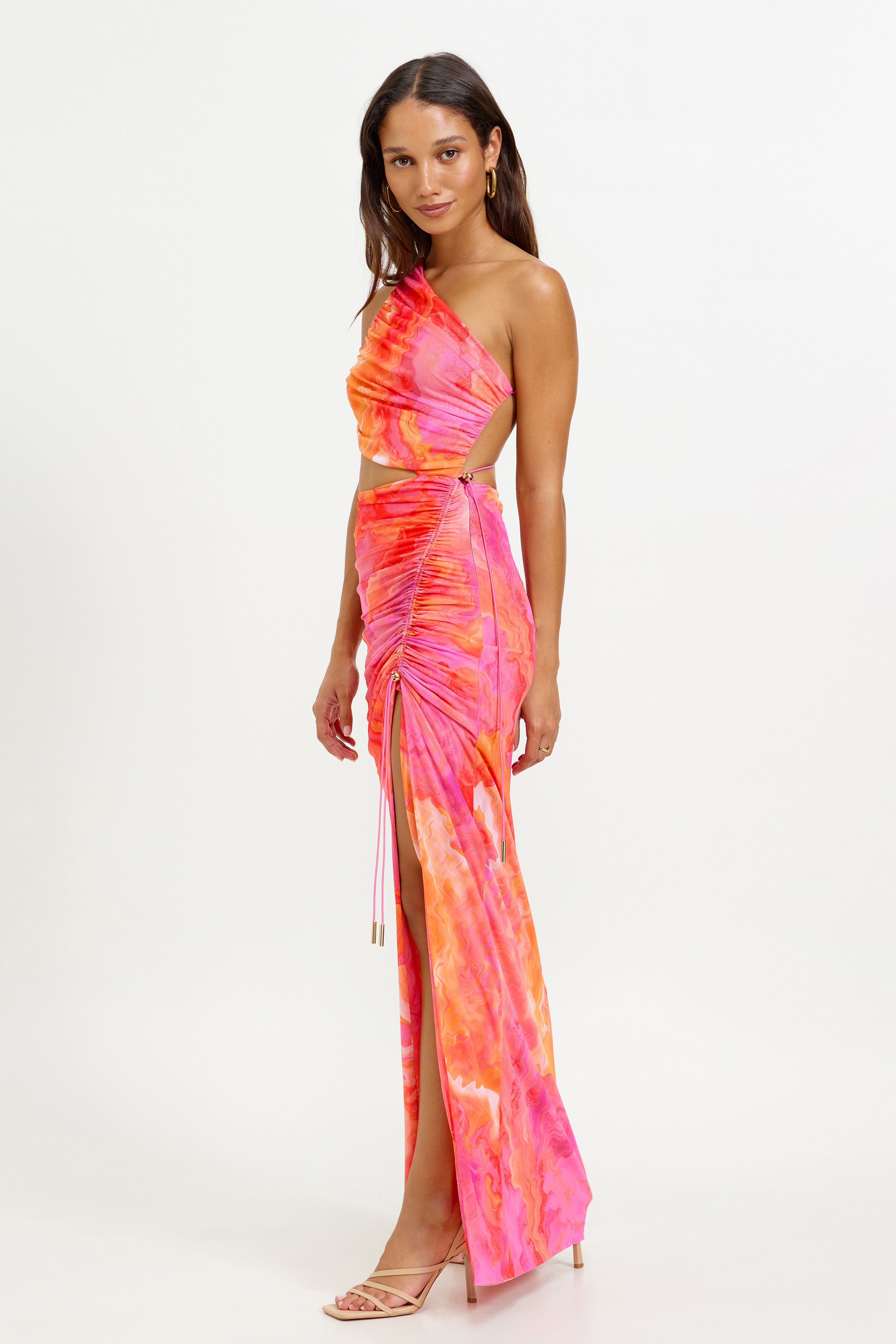 Havana Dress featuring a ruched asymmetric one-shoulder design with side cutout and high split in vibrant pink and orange print