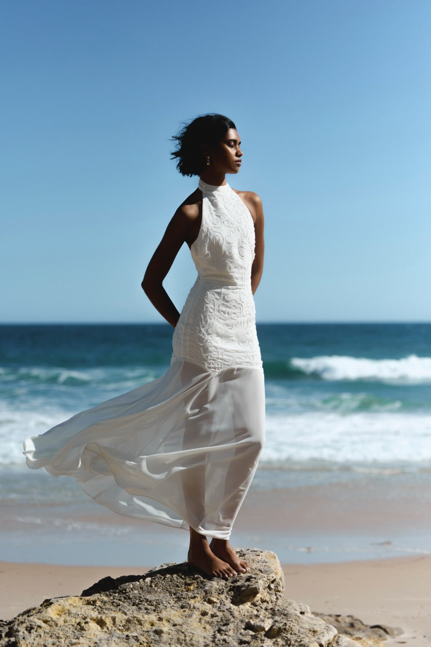 Imani Dress featuring high neck and intricate textured detailing with flowing skirt in ivory for formal and bridesmaid wear by Studio Lexi