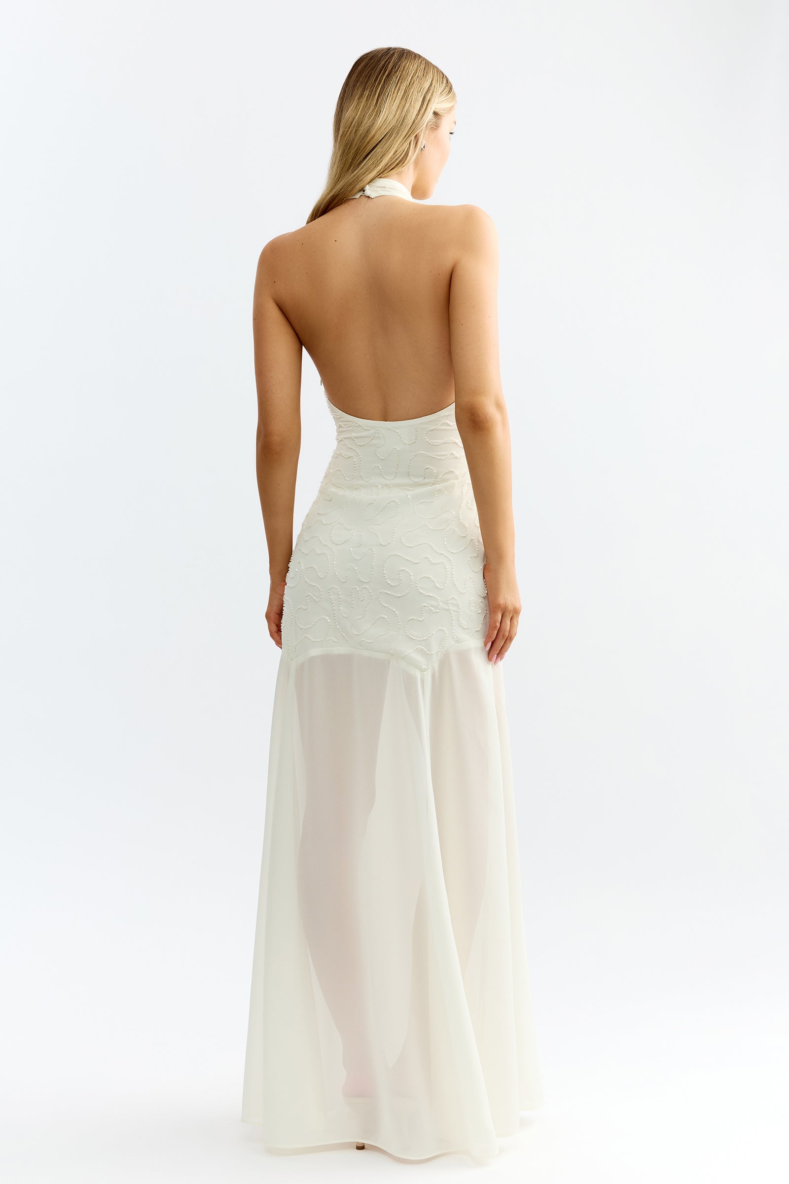 Imani Dress featuring backless design and textured bodice with sheer flowing skirt in ivory for formal and bridesmaid by Studio Lexi