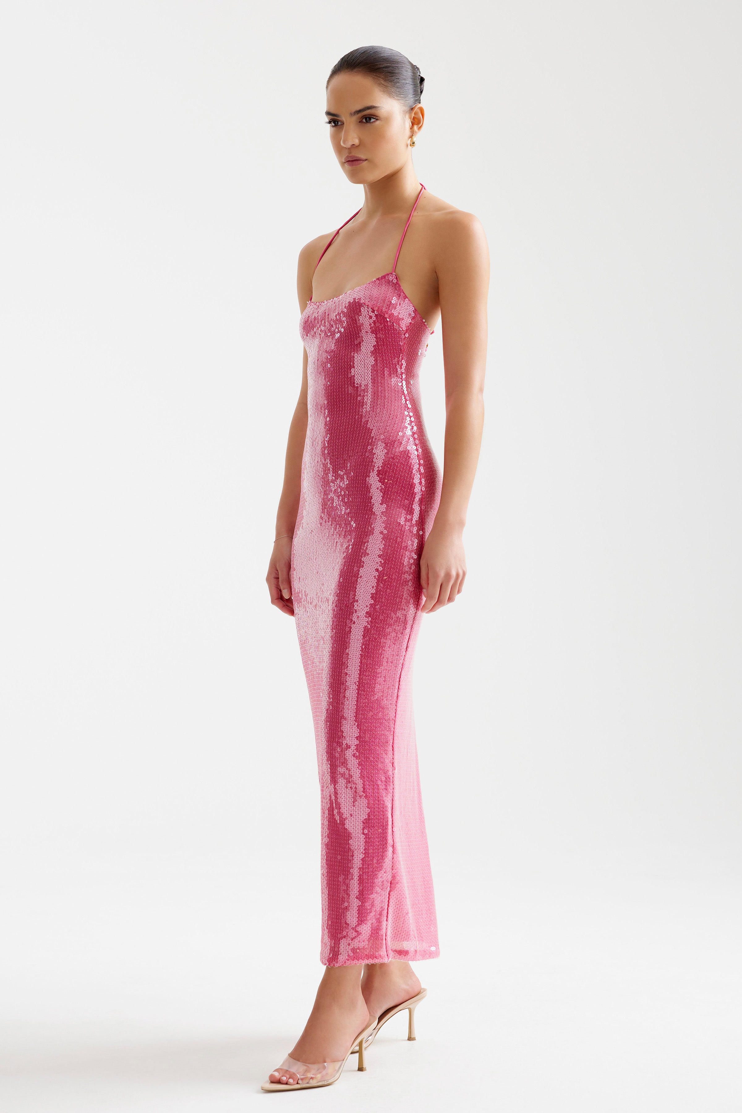 Imma Dress features a sleek silhouette with thin straps and sequin embellishments in vibrant bright melon for party wear