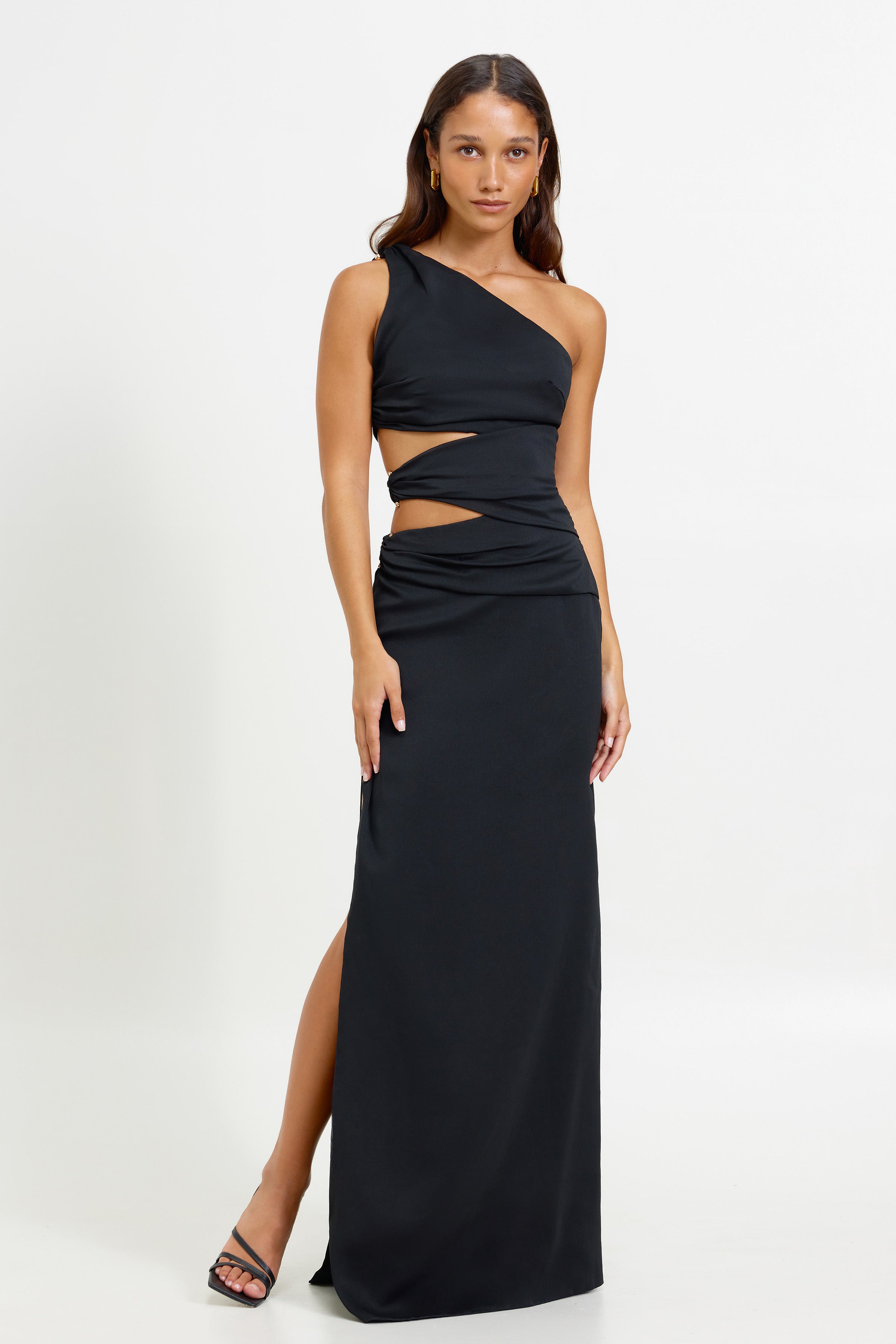 Isabel Dress featuring one-shoulder cutouts and side split in black for elegant formal and black tie occasions