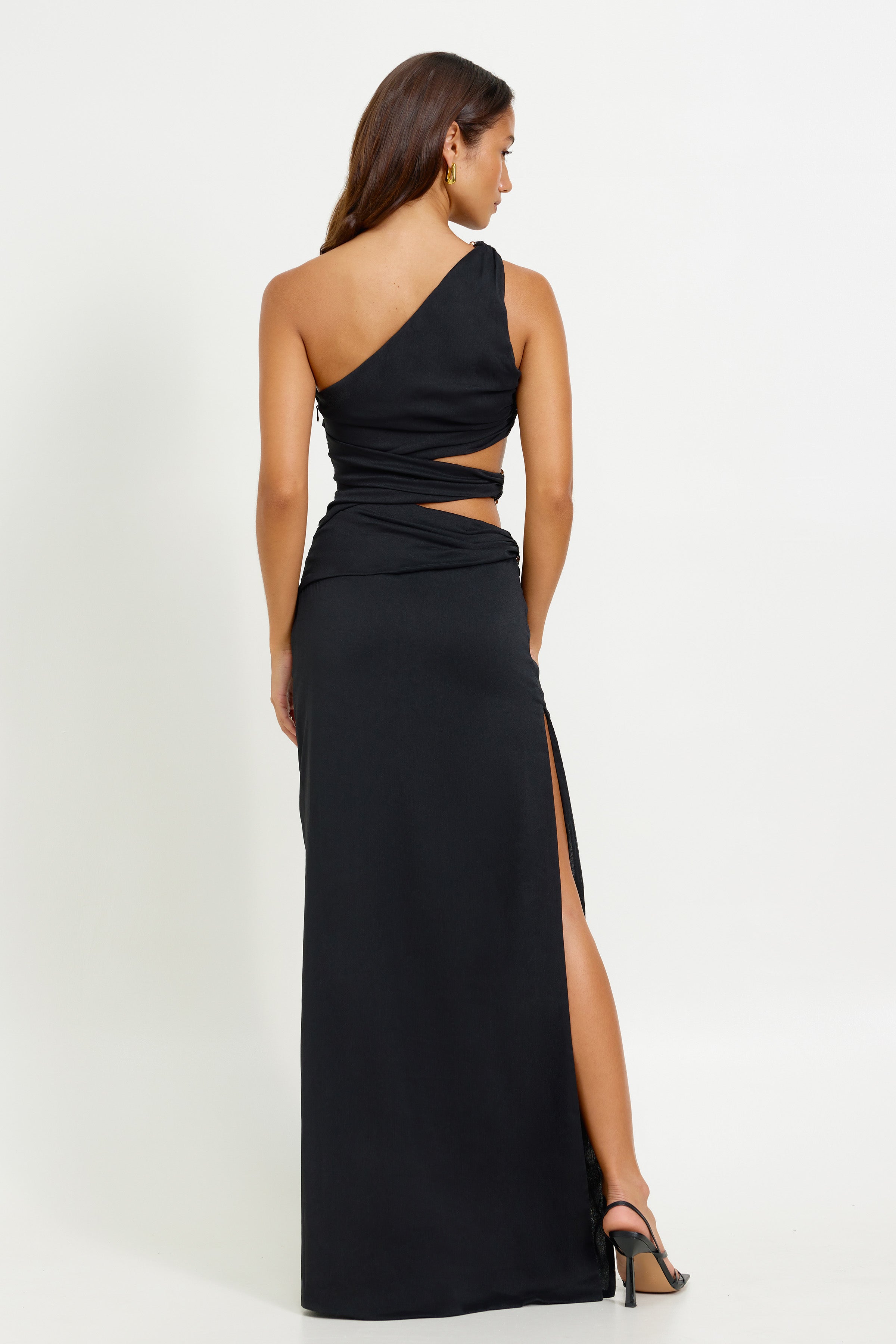 Isabel Dress featuring an asymmetric one-shoulder design with side cutouts and high split in black for formal occasions