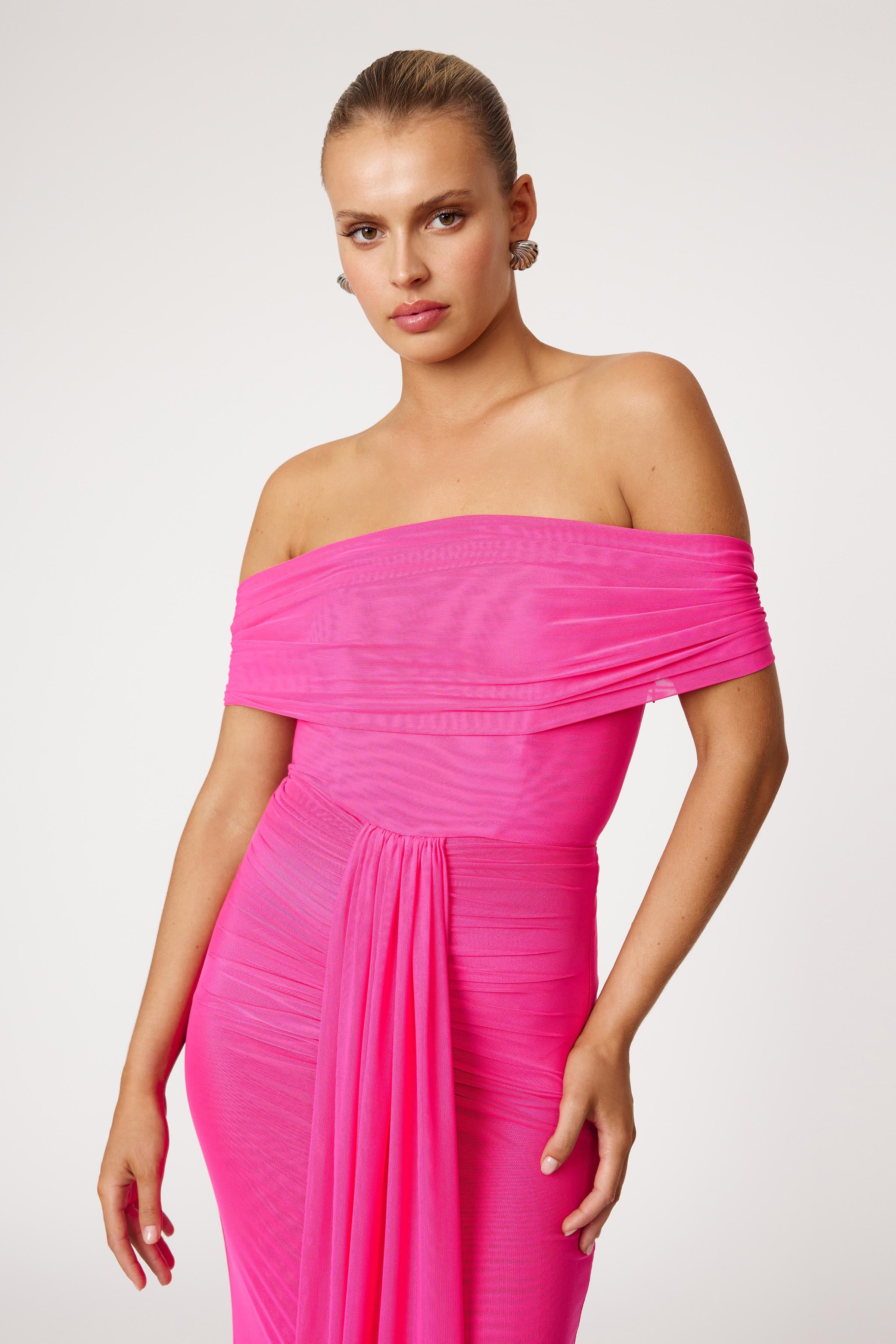 Jora Dress off-shoulder design with ruched drape detail in vibrant raspberry for formal and wedding guest events by Studio Lexi