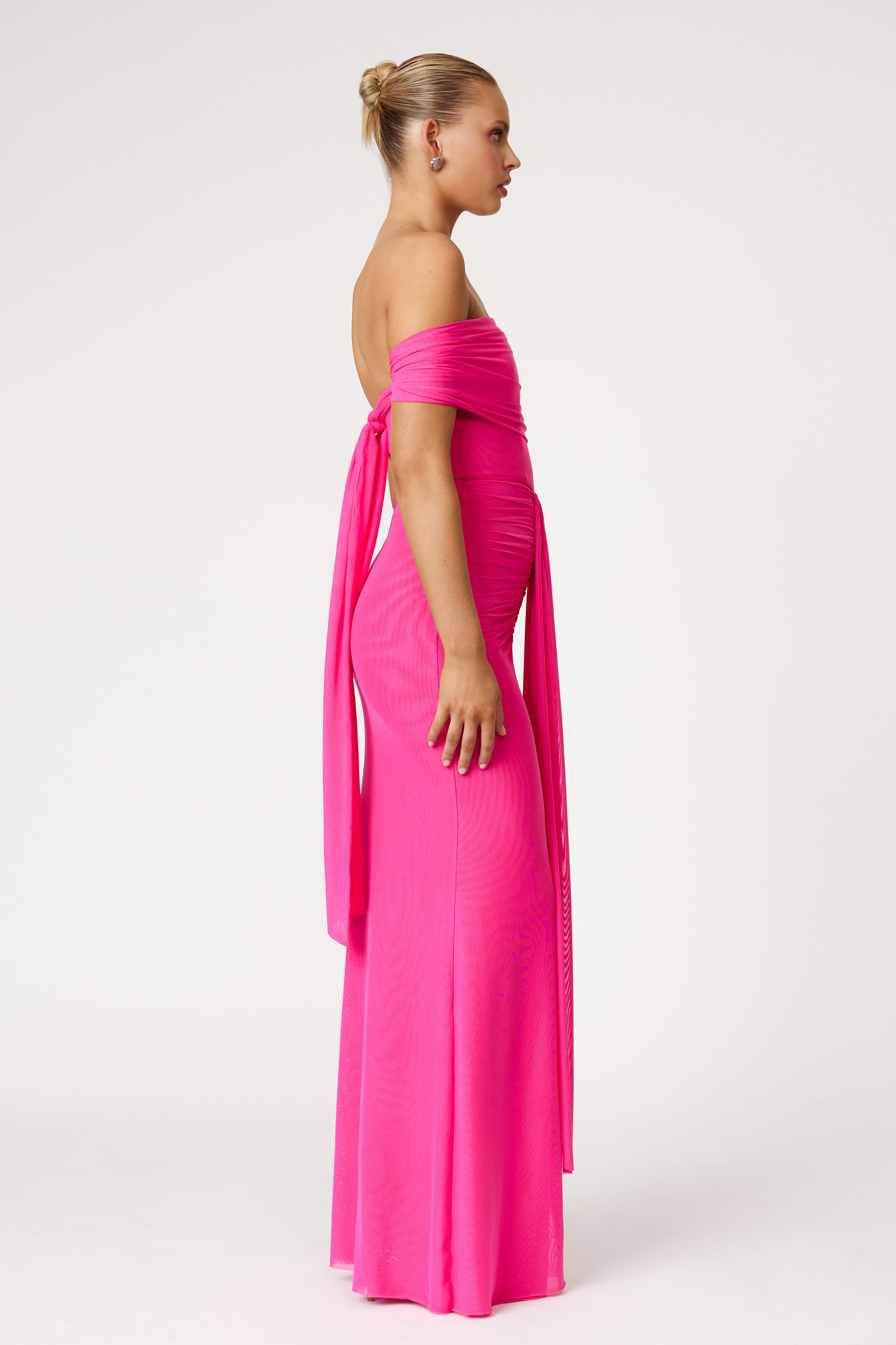 Jora Dress elegant off-shoulder design with draped back tie in vibrant raspberry for formal and wedding guest events by Studio Lexi