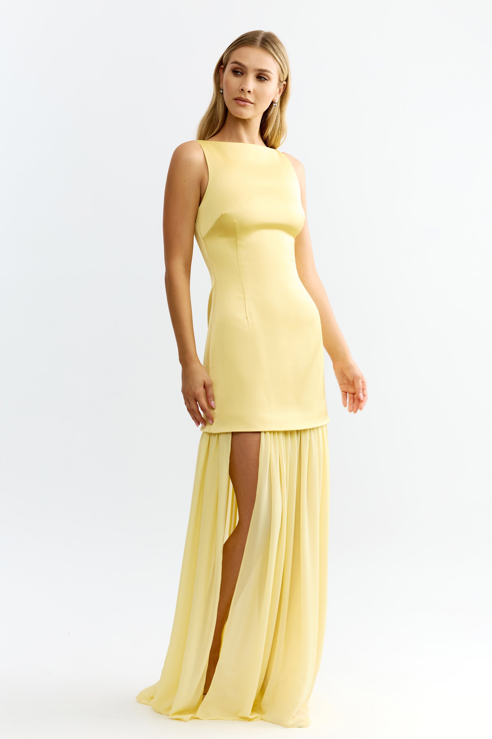 Julia Dress featuring sleeveless fitted bodice and flowing skirt with high side split in soft sunflower by Studio Lexi
