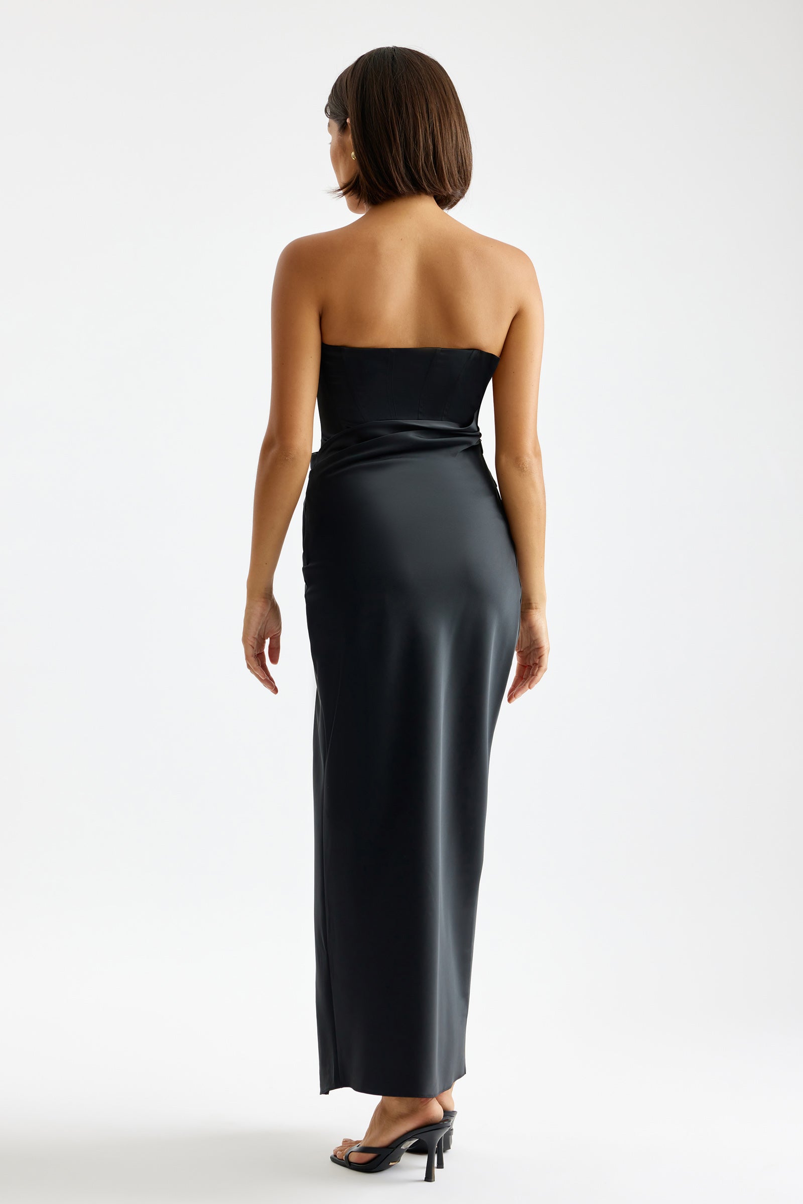 Kaia Dress featuring a strapless silhouette with smooth black satin fabric and bra-friendly fit by Studio Lexi