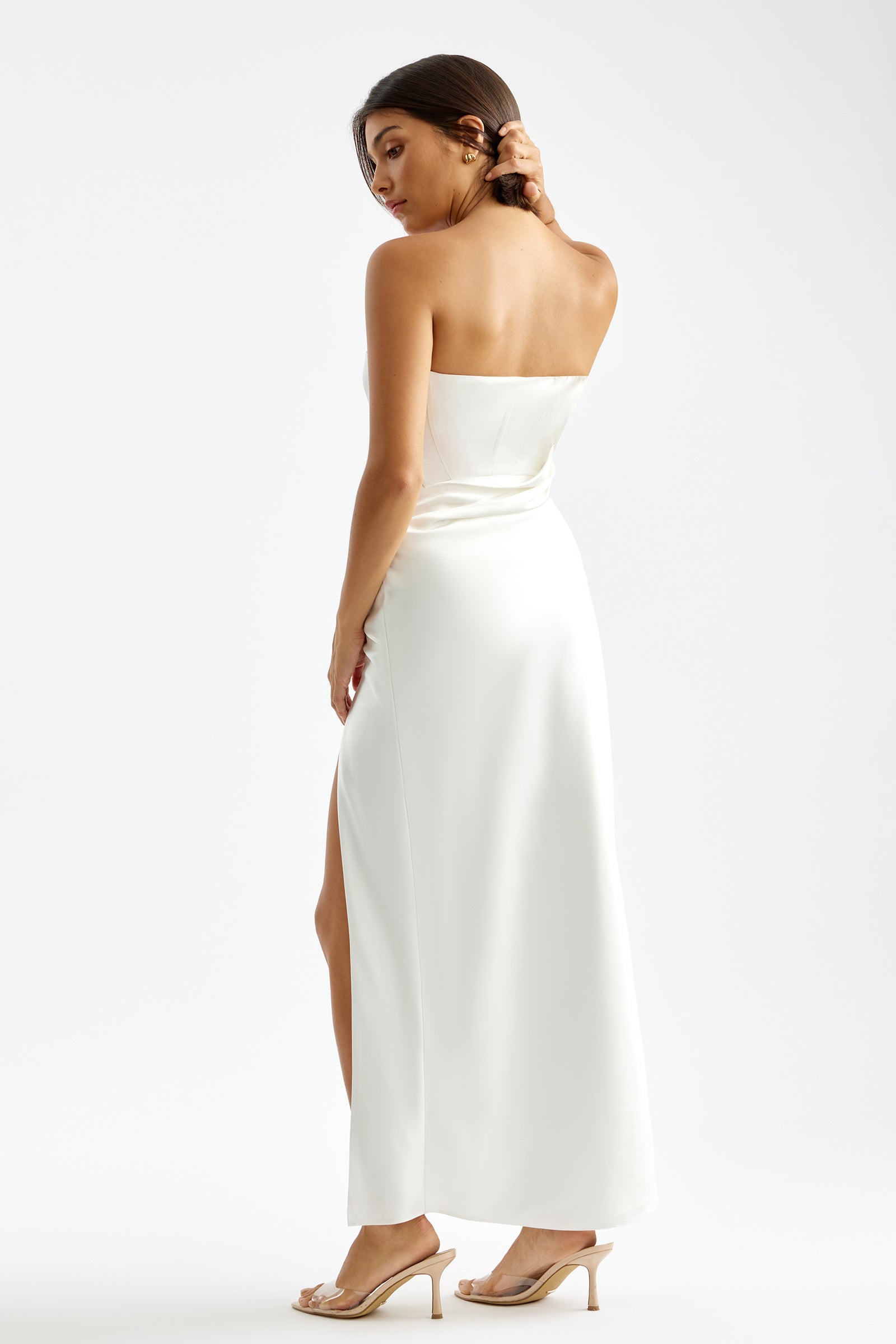 Kaia Dress featuring a strapless silhouette with side split in white satin for formal and cocktail occasions by Studio Lexi