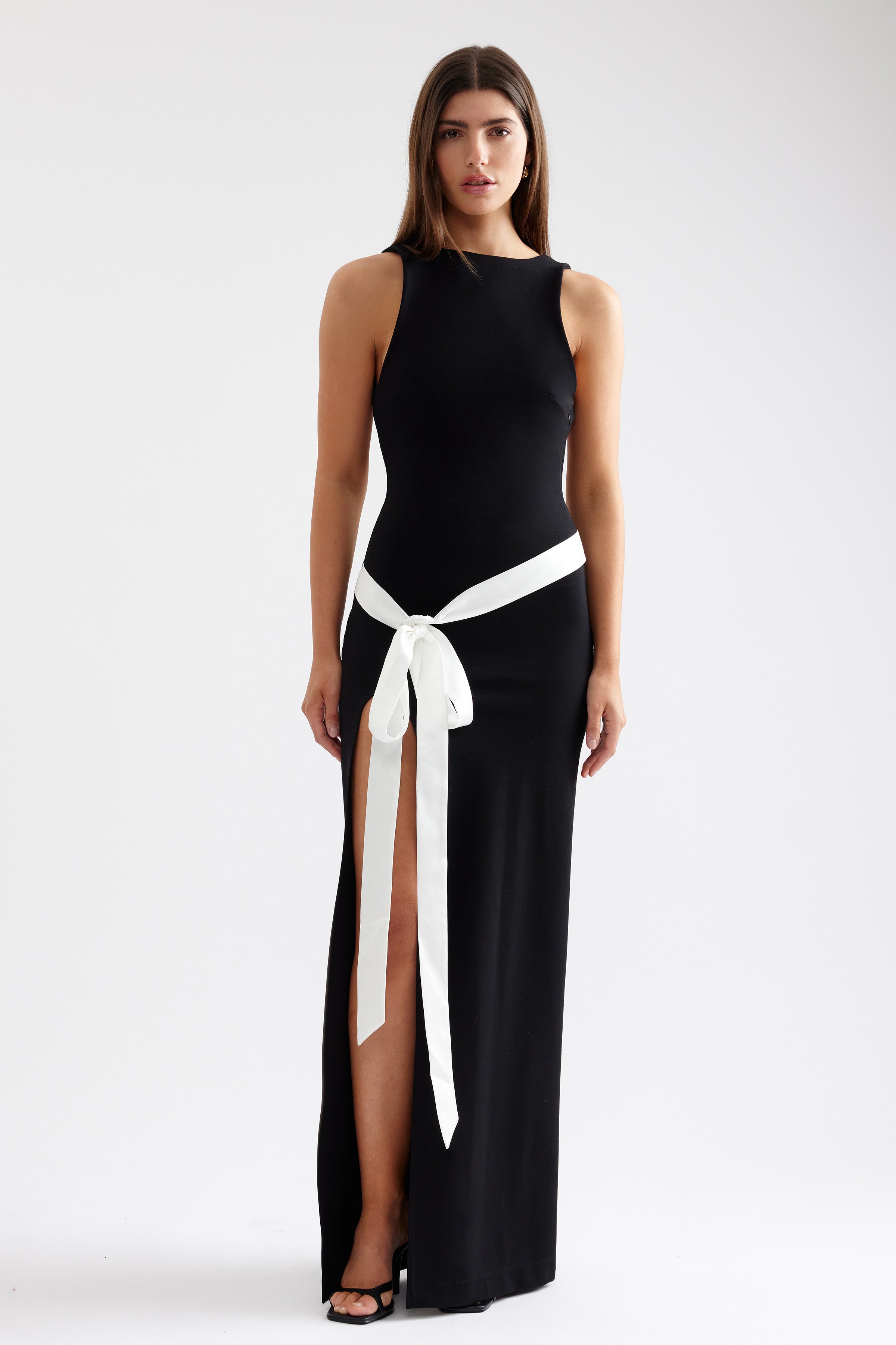 Katherine Dress sleek sleeveless gown with high side split and striking white sash for formal black tie events