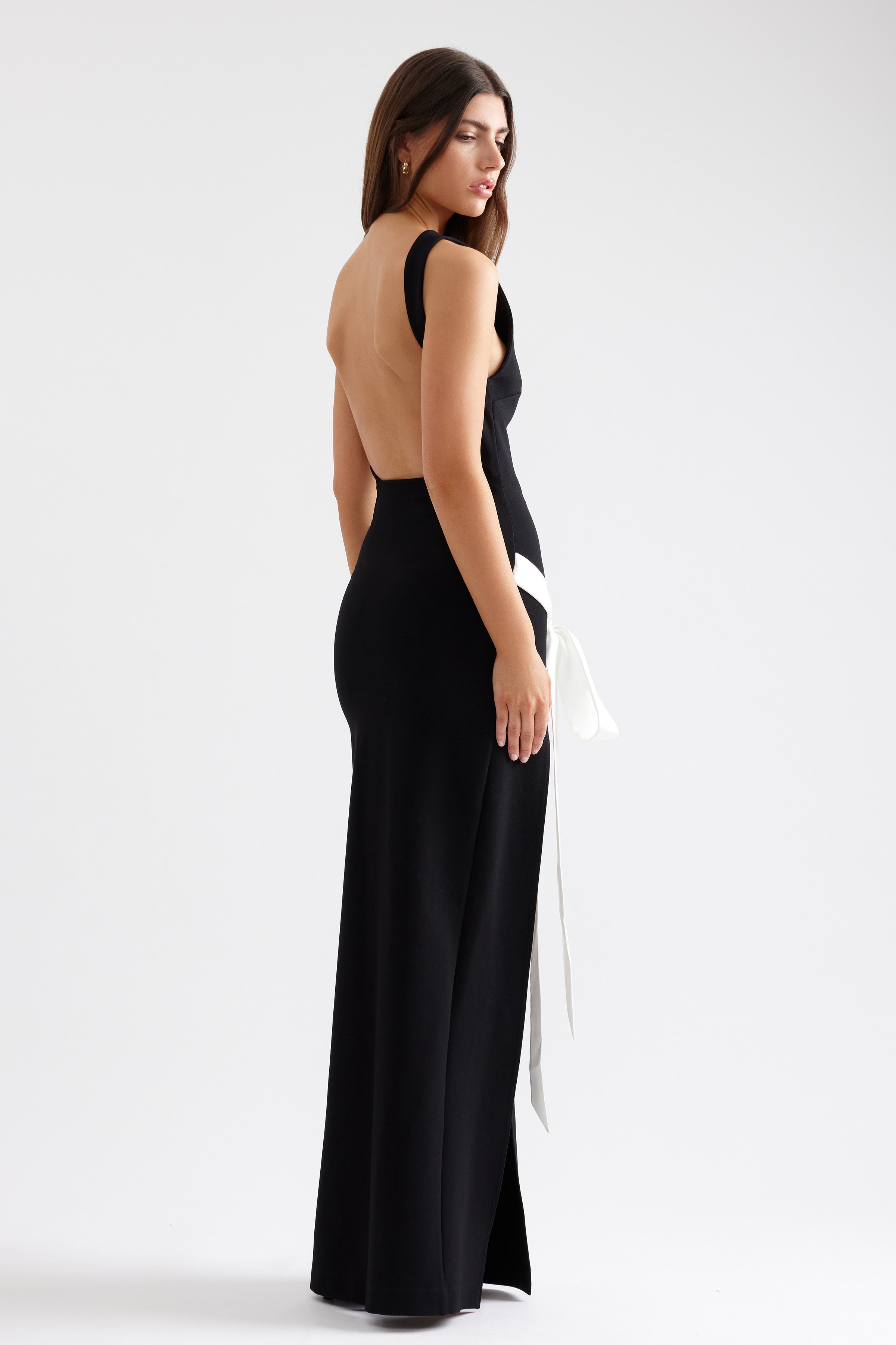 Katherine Dress backless fitted gown with high side split and contrasting white sash in black for formal black tie events