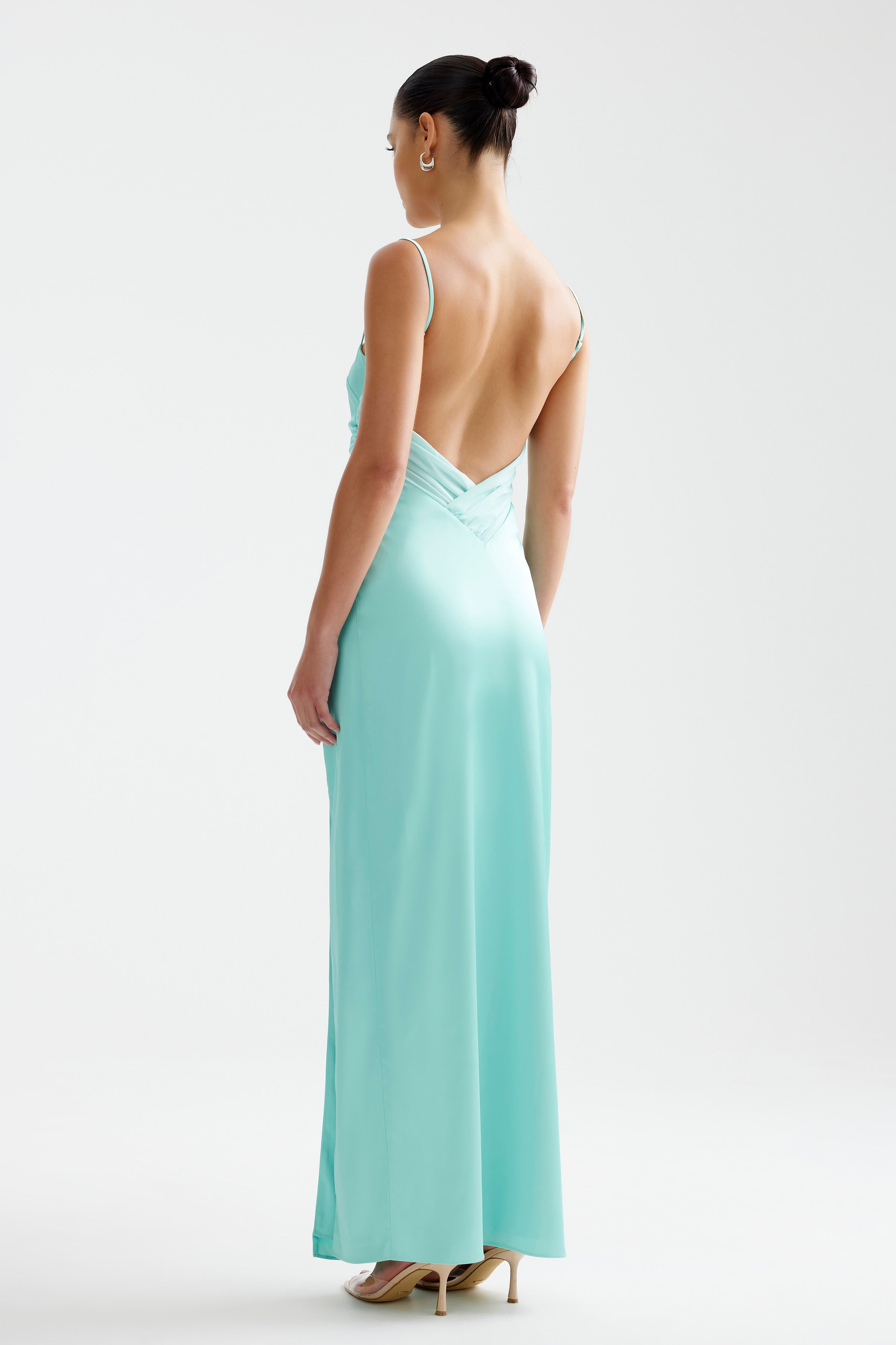Kiri Dress featuring a backless design with thin straps in aqua for bridesmaid and formal events by Studio Lexi