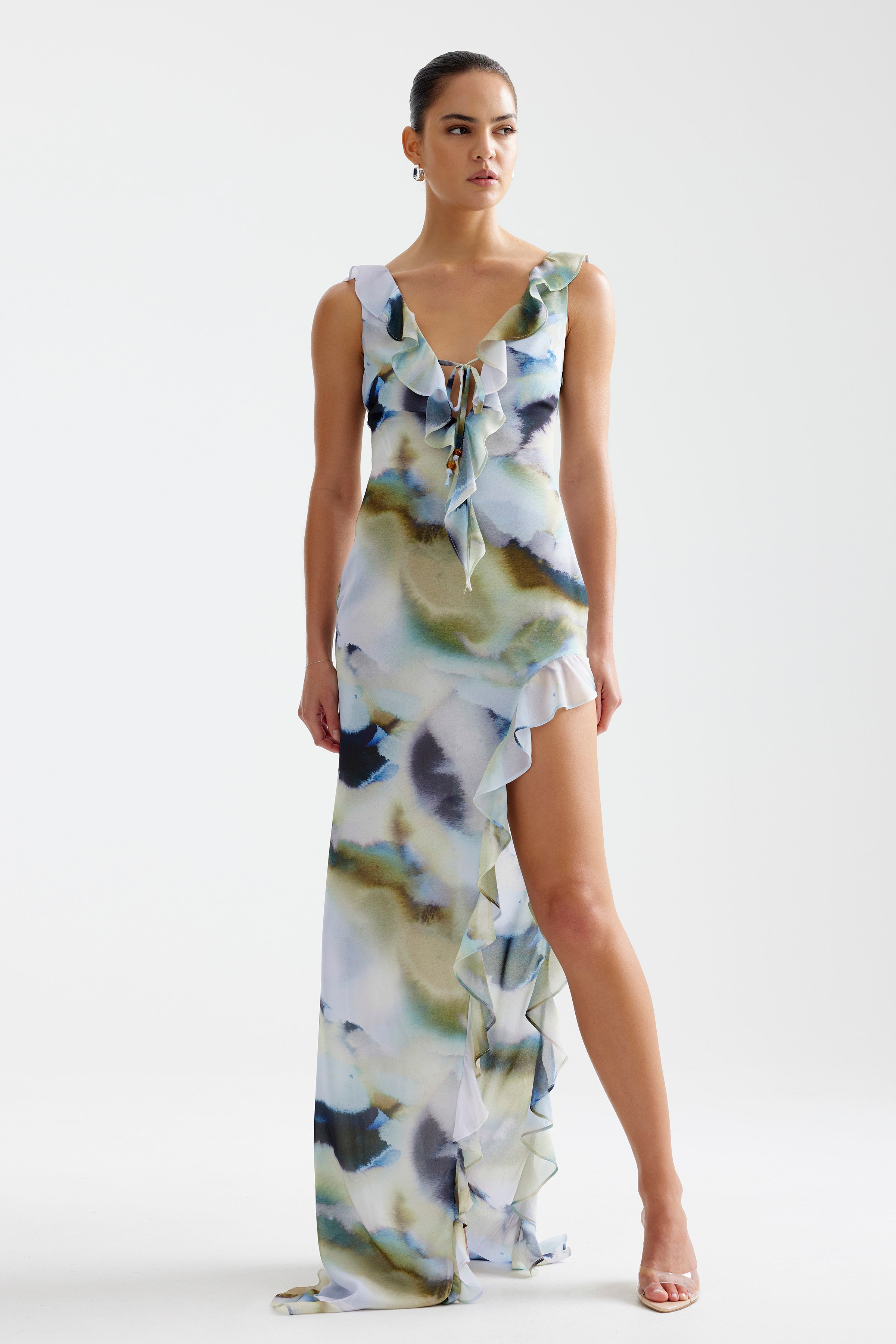 Laguna Dress featuring watercolor print with ruffled neckline, tie front, and high split small train in blue mineral print by Studio Lexi